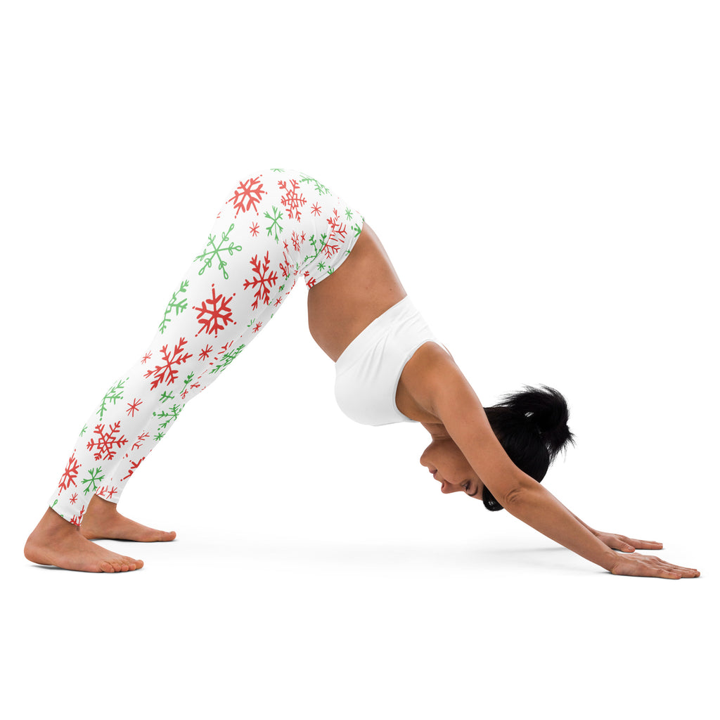 White women’s buttery soft yoga leggings with festive red and green snowflake pattern for christmas wear