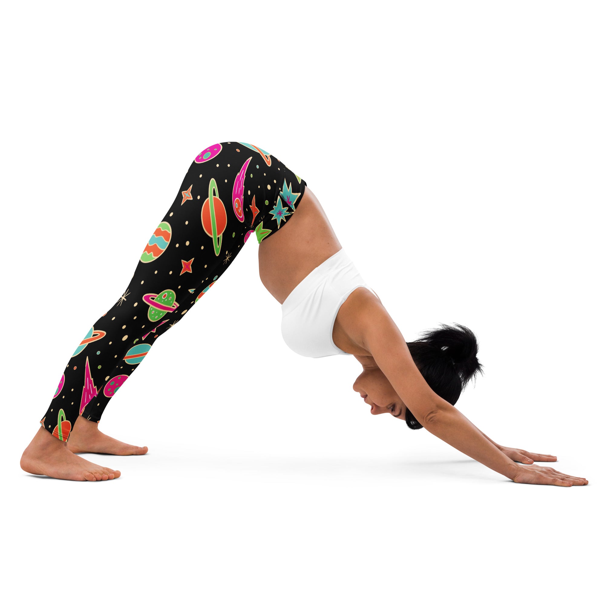 Black women’s buttery soft yoga leggings with neon pink green orange and blue retro space planets and rockets pattern