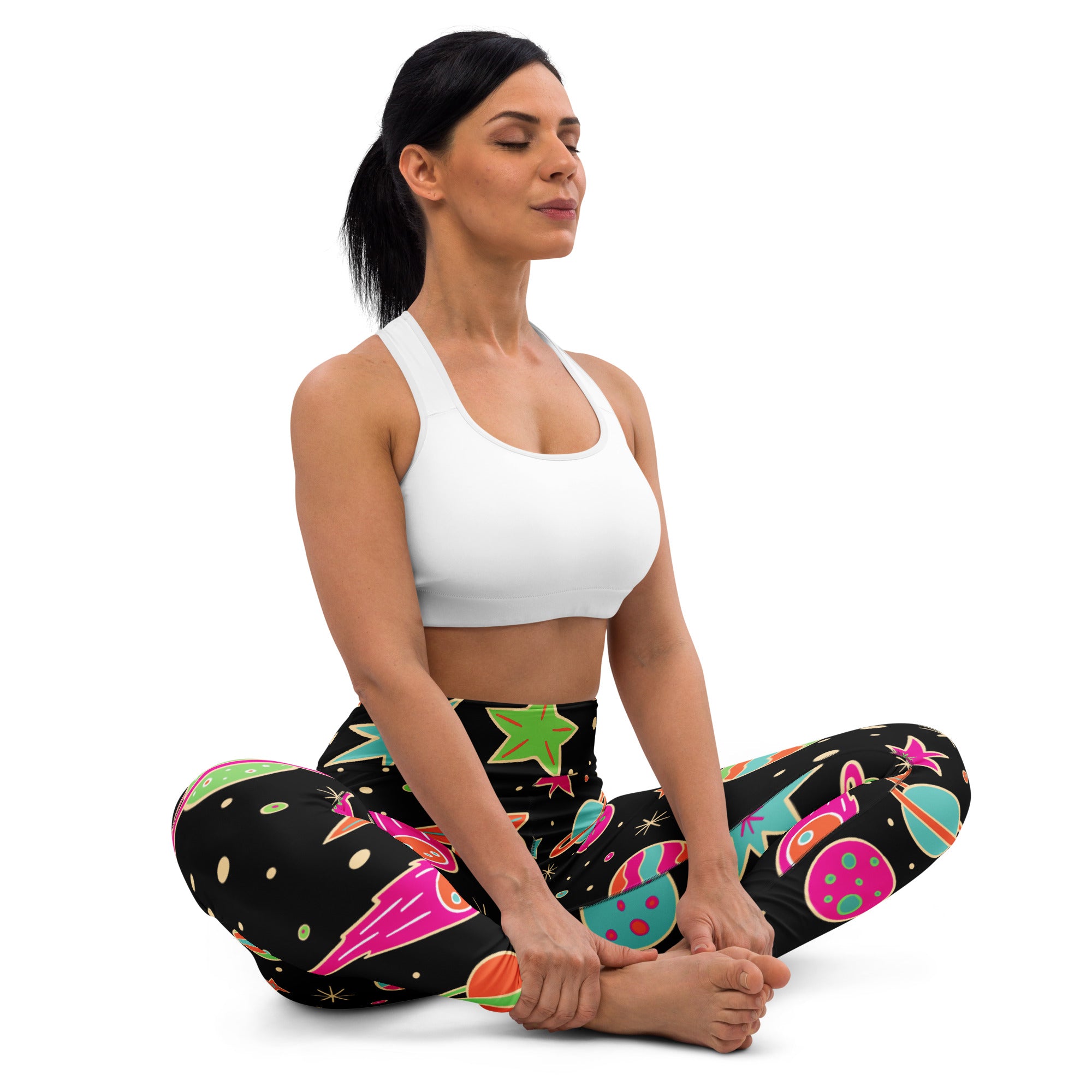 Women’s neon galaxy buttery soft yoga leggings in black with vibrant neon pink green and teal space rockets planets and stars