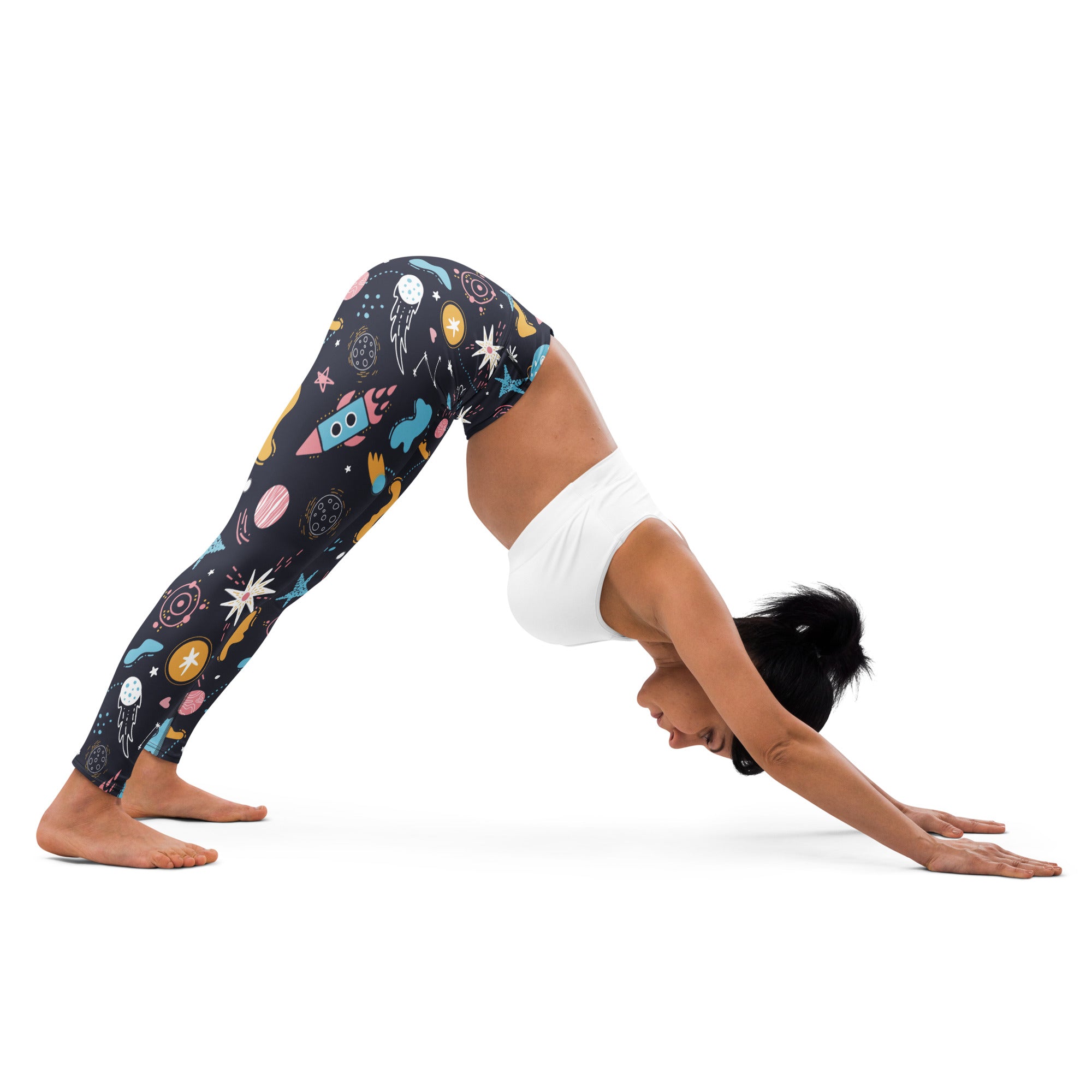 Women’s outer space buttery soft yoga leggings in black with vibrant pastel rockets planets and stars space pattern