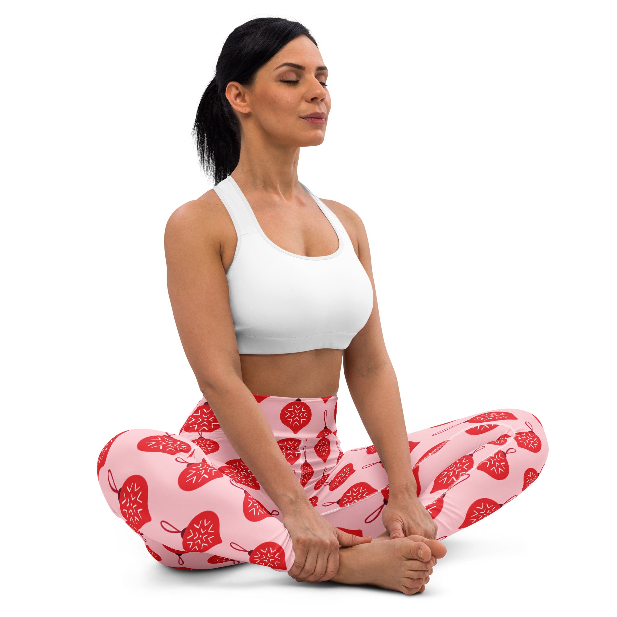 Women’s pink buttery soft yoga leggings with red holiday ornament patterns for christmas workouts