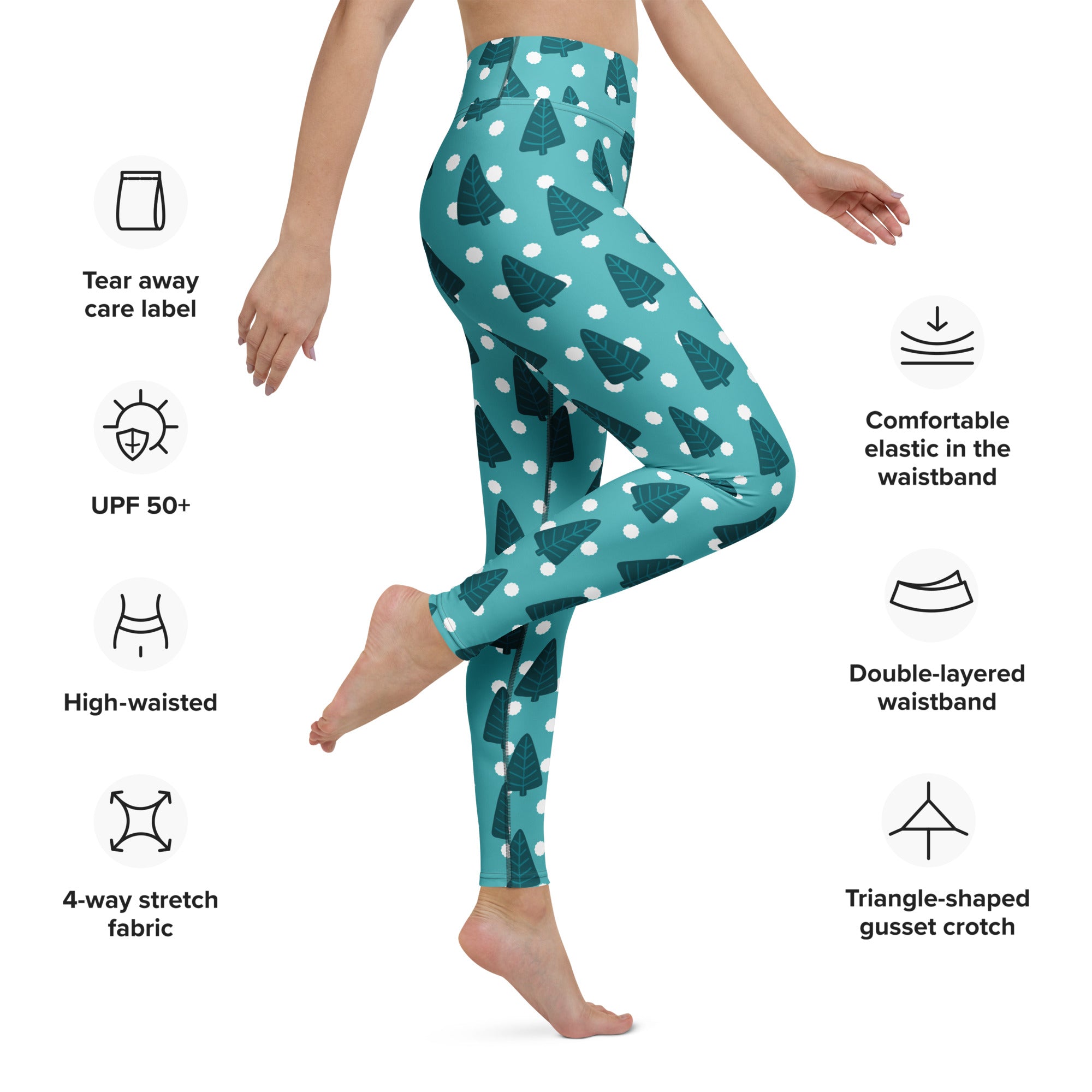 Women’s teal buttery soft yoga leggings with dark green pine tree pattern and white polka dots for winter wear