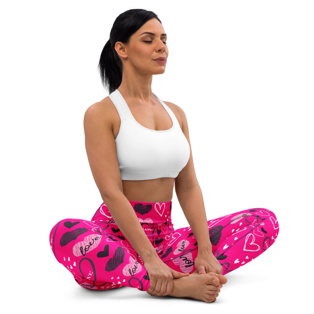Women’s hot pink buttery soft high waisted yoga leggings with playful black and white heart love pattern and quick drying fabric