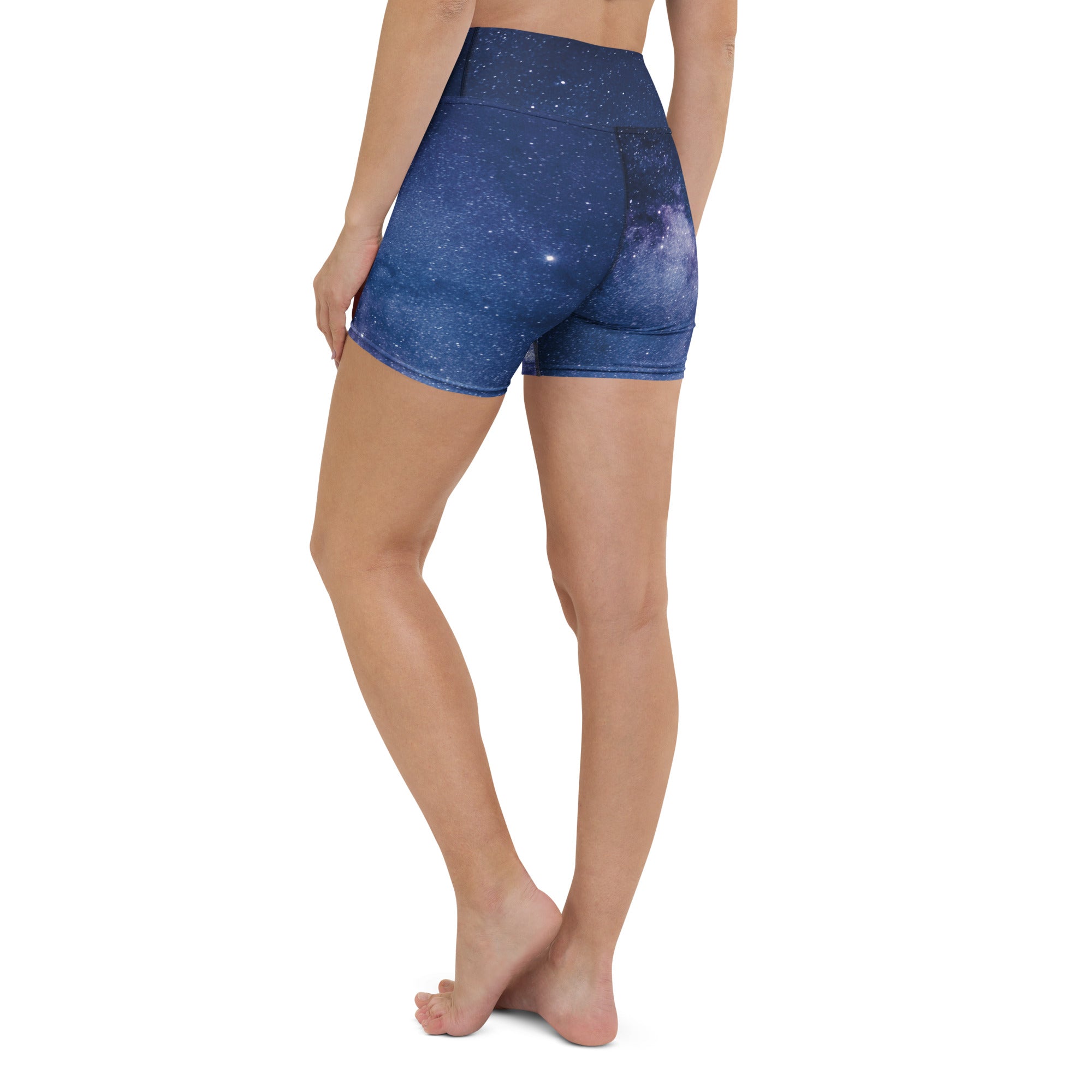Dark blue high waisted buttery soft women’s yoga shorts with realistic galaxy print featuring stars and nebulae
