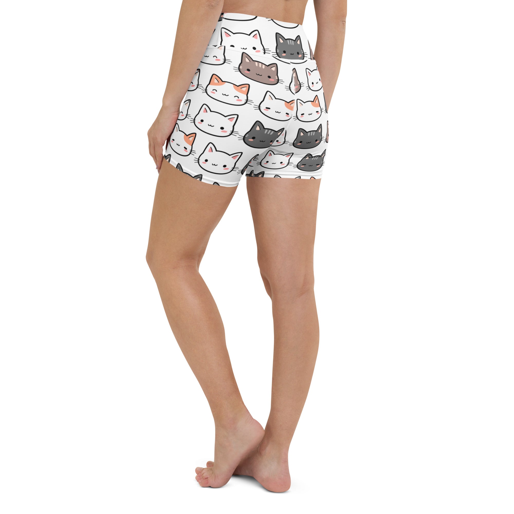 Women’s white high waisted buttery soft yoga shorts with a colorful cartoon cat pattern for active wear