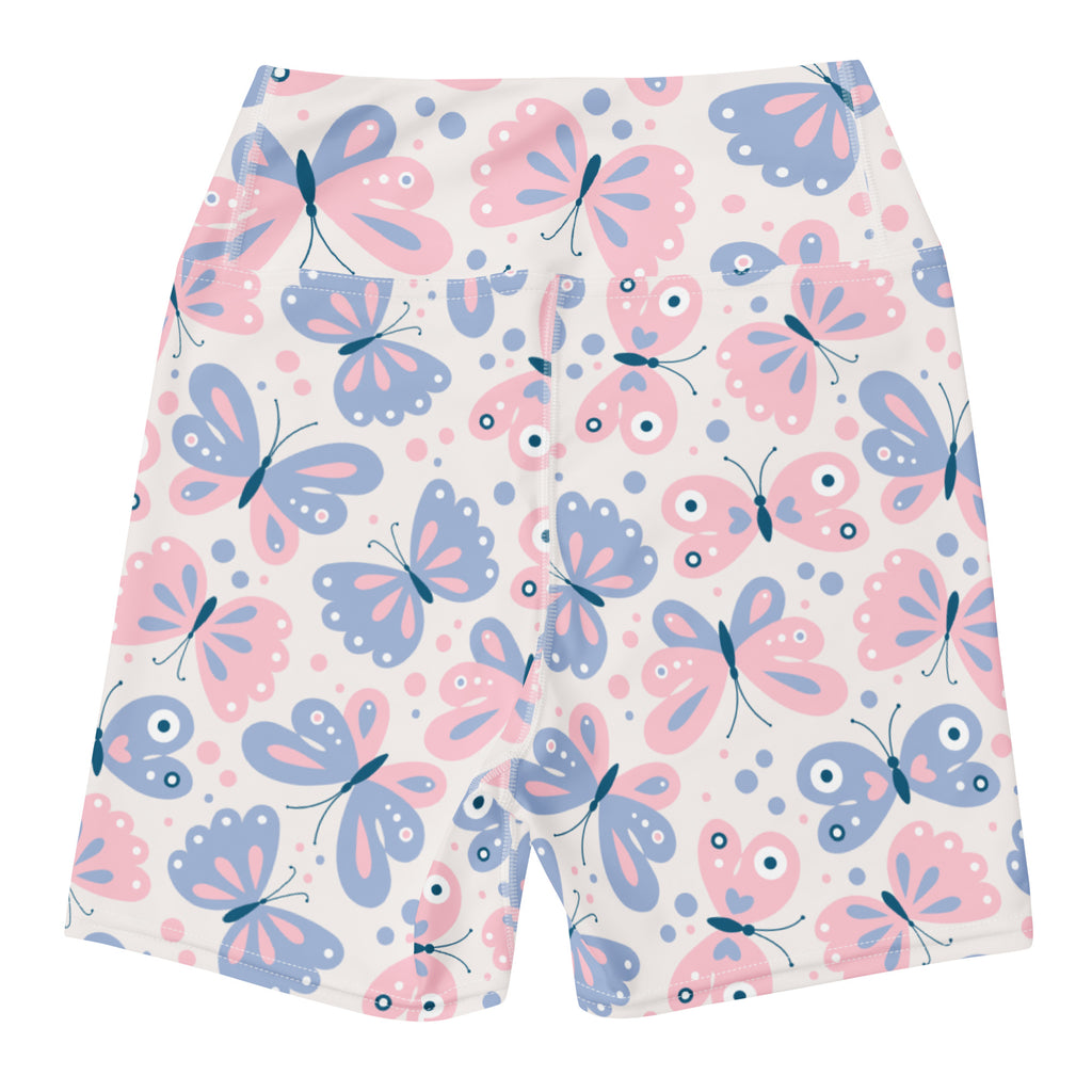 Women’s high waisted buttery soft yoga shorts in pastel pink and blue with playful butterfly cartoon print on white background