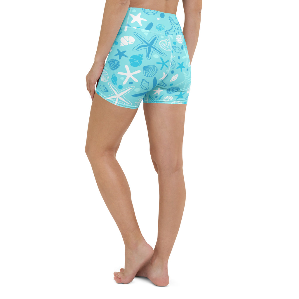 Women’s light blue high waisted buttery soft yoga shorts with white and dark blue starfish and shells pattern