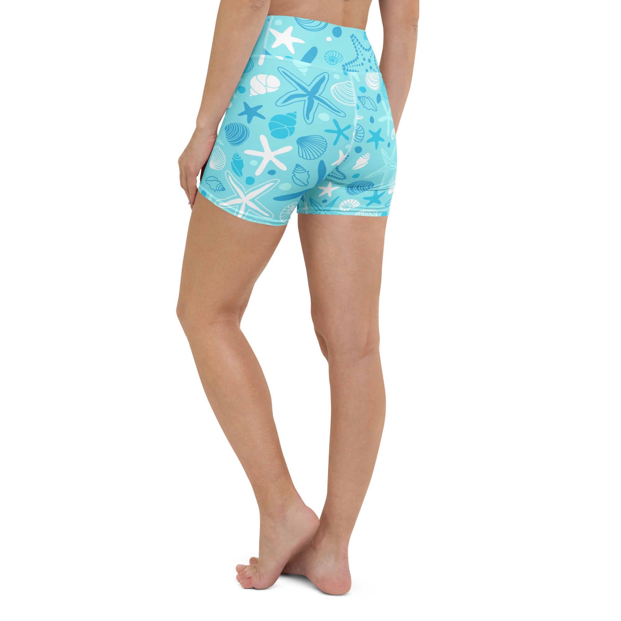 Women’s light blue high waisted buttery soft yoga shorts with white and dark blue starfish and shells pattern