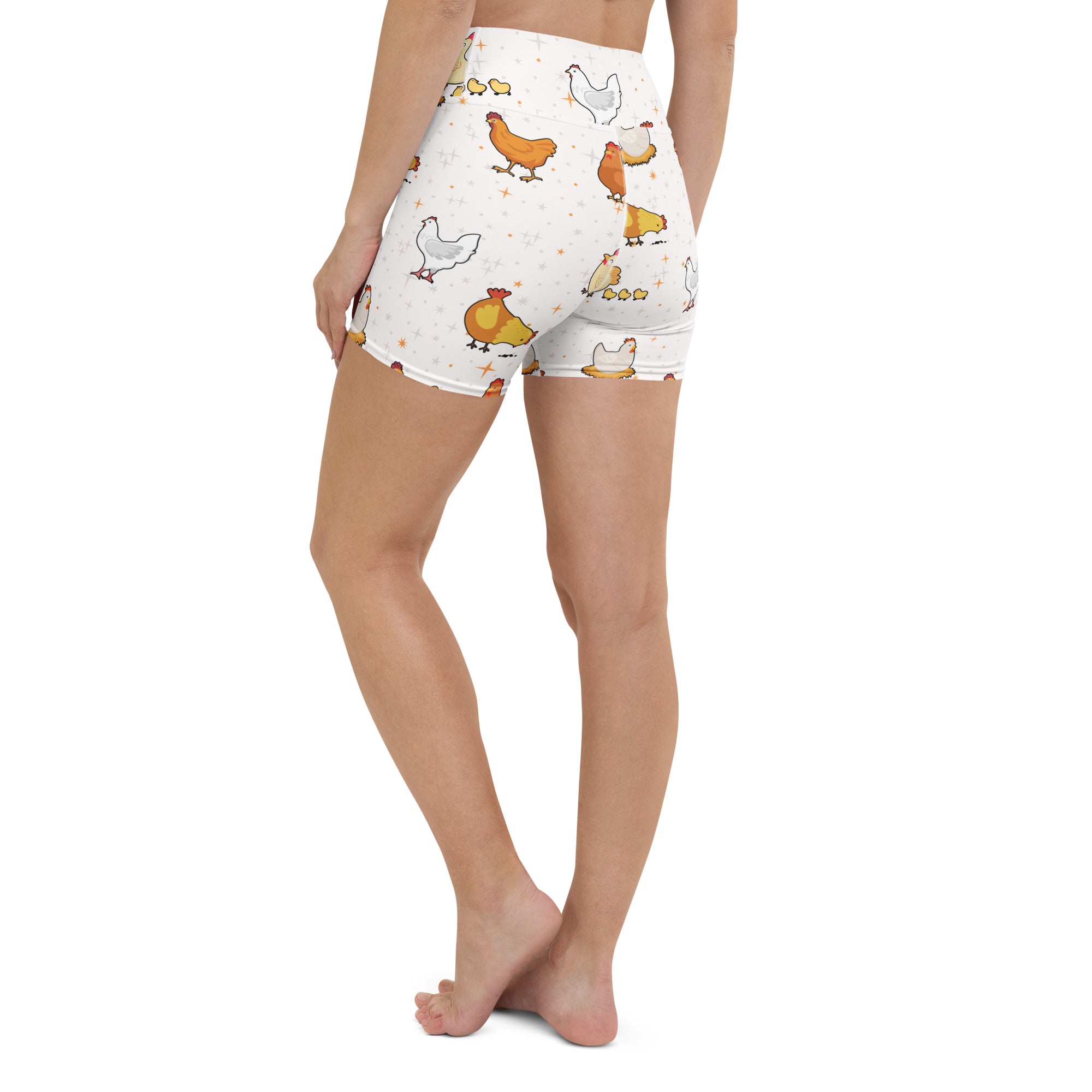 Women’s white high waisted buttery soft yoga shorts with playful orange chickens and yellow chicks pattern