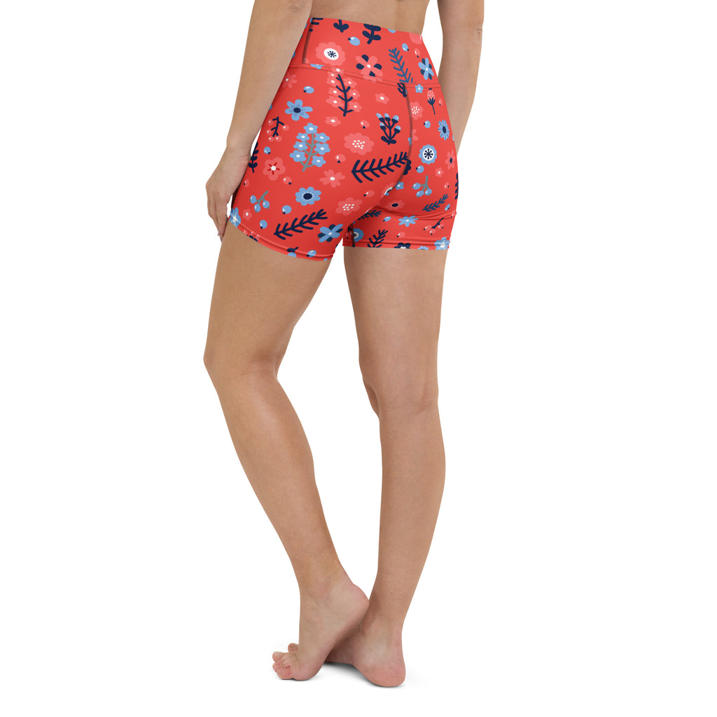 Women’s red high waisted buttery soft yoga shorts with blue and black floral pattern for active wear