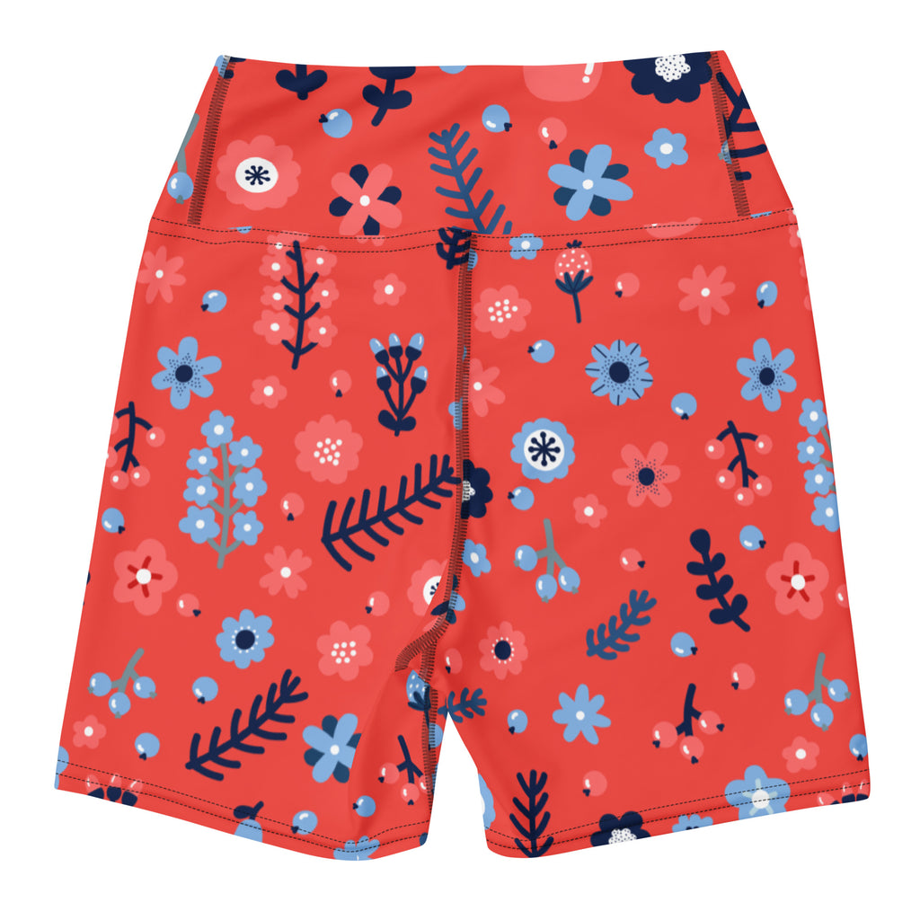Women’s red and blue floral high waisted buttery soft yoga shorts with pink flowers and green foliage on coral background
