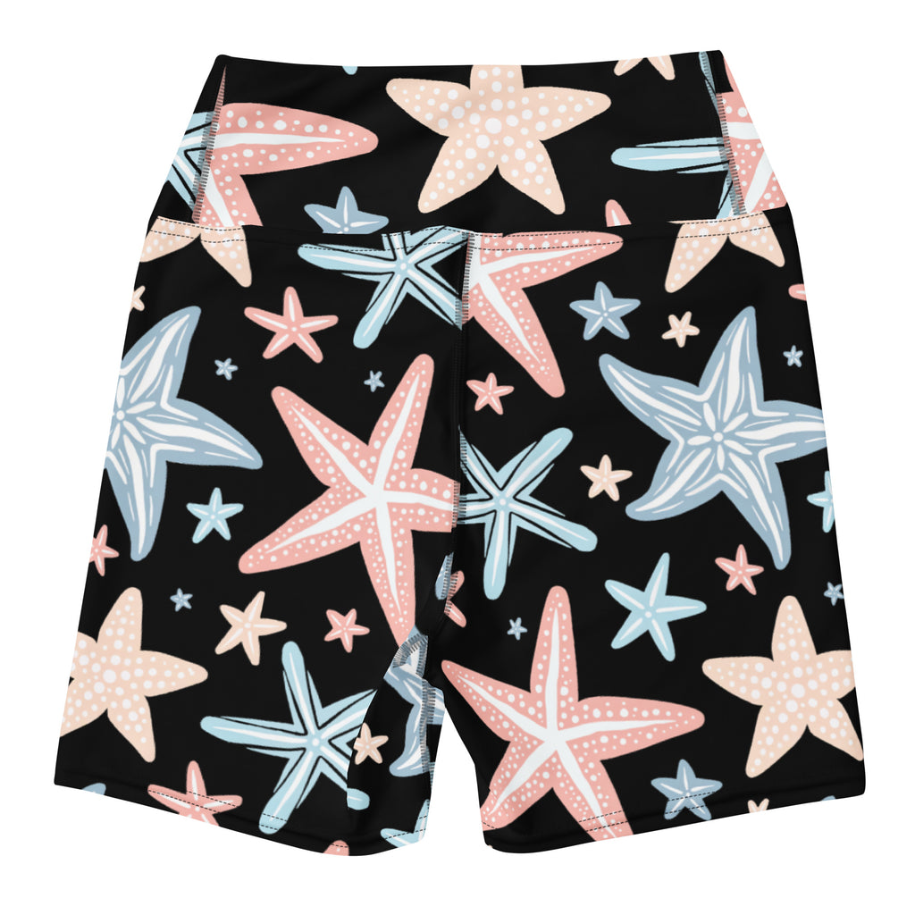 Women’s black high waisted buttery soft yoga shorts with playful pink light blue and beige starfish pattern