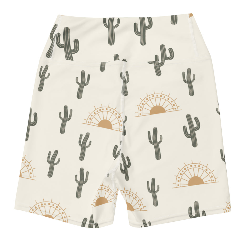 Women’s cream-colored high waisted buttery soft yoga shorts with gray cactus and tan sunset pattern