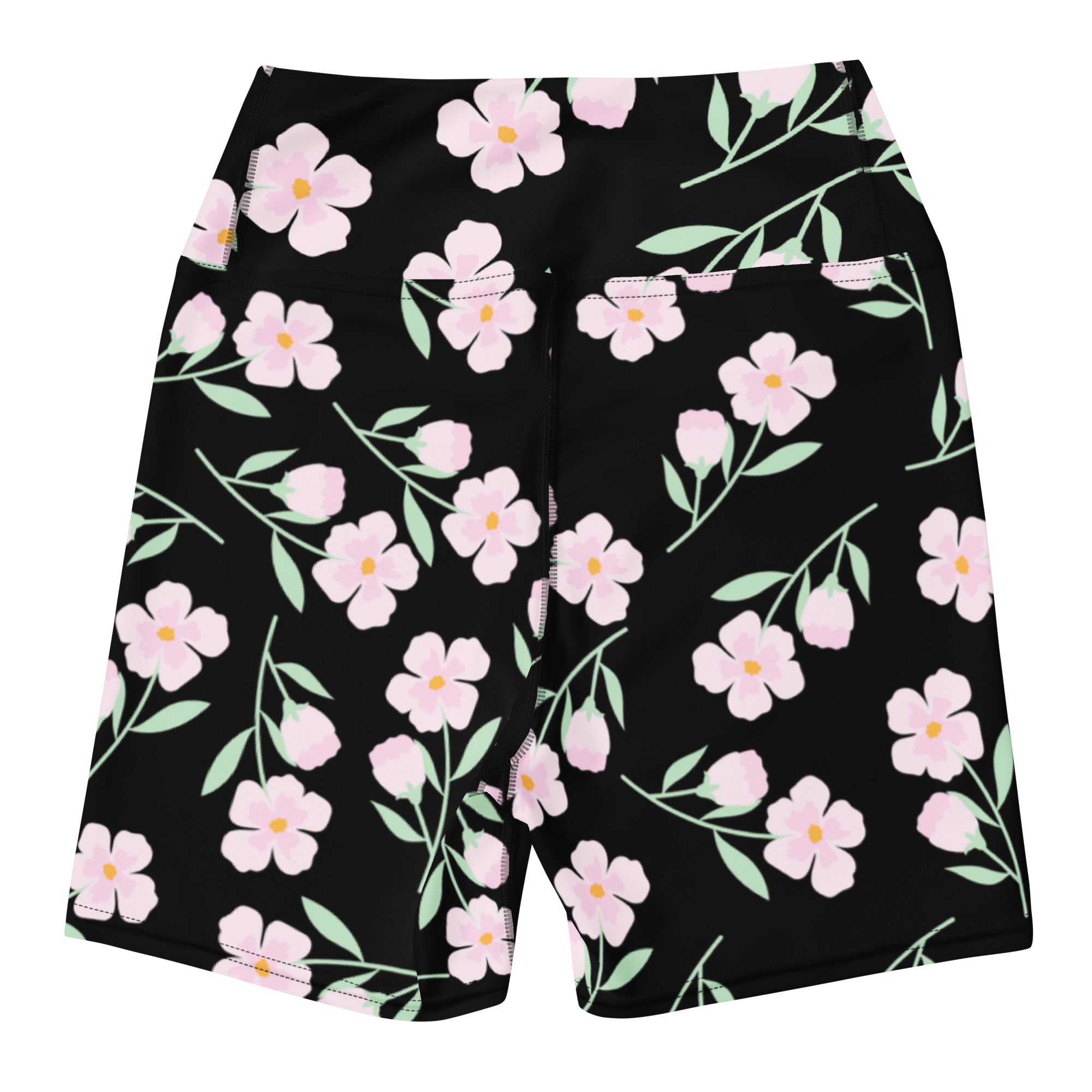 Women’s high waisted black floral yoga shorts with vibrant pink and yellow flower pattern and buttery soft fabric
