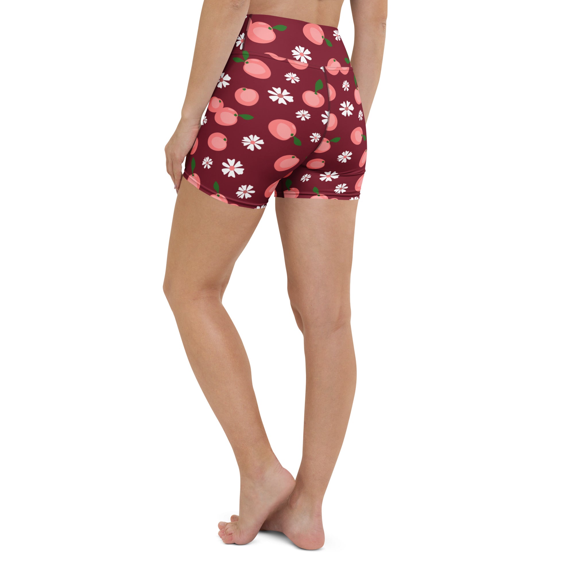 Women’s maroon high waisted buttery soft yoga shorts with a playful pink peach and white floral pattern