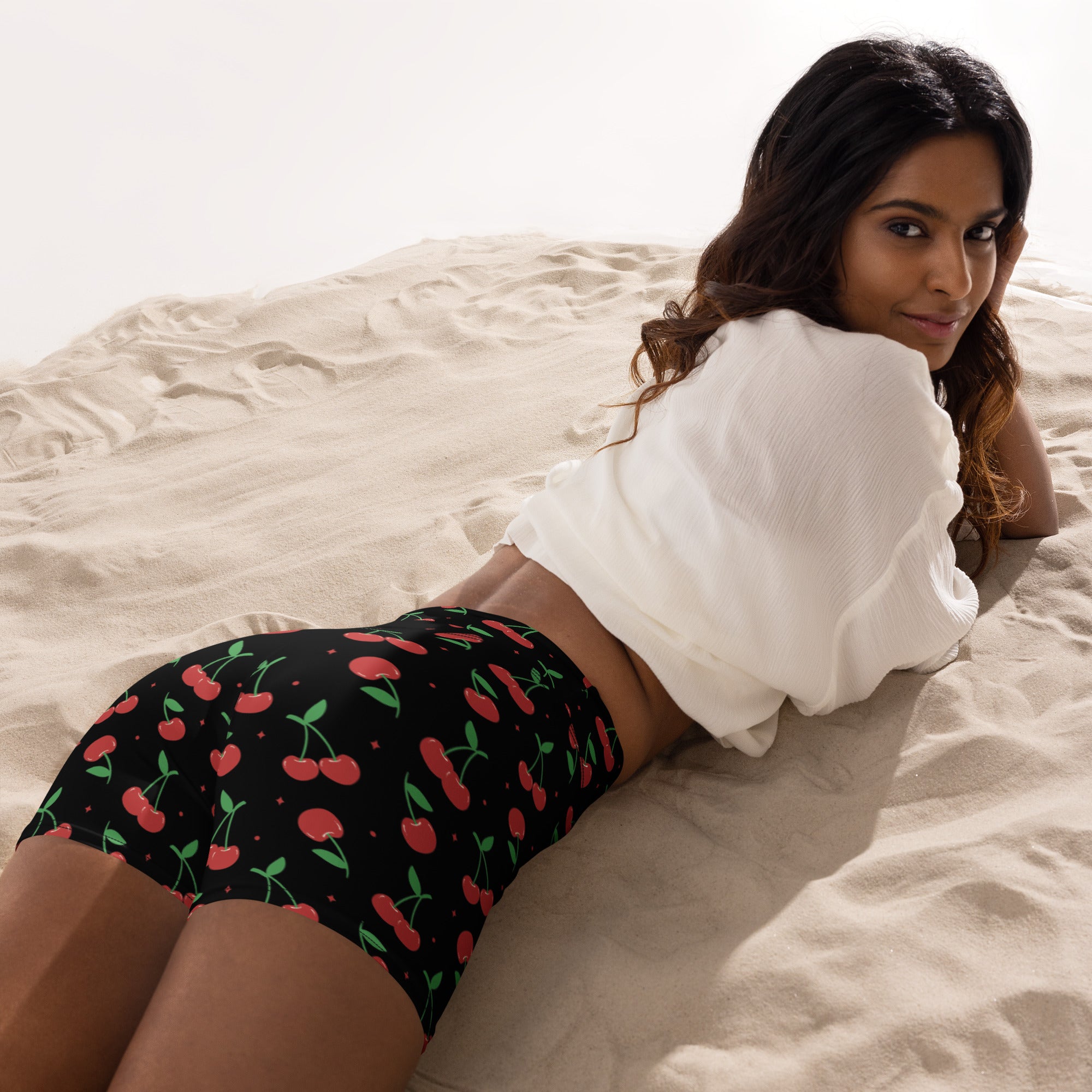 Women’s high waisted black cherry yoga shorts with vibrant red and green cherry pattern buttery soft fabric