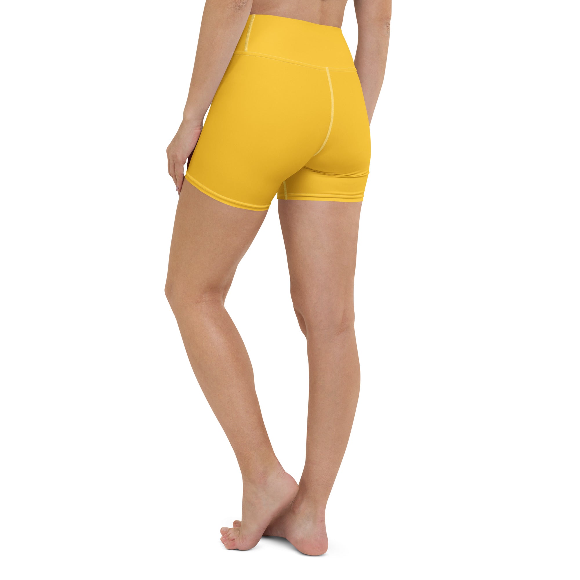 Women’s buttery soft high waisted yellow yoga shorts made from soft fabric for comfortable activewear use