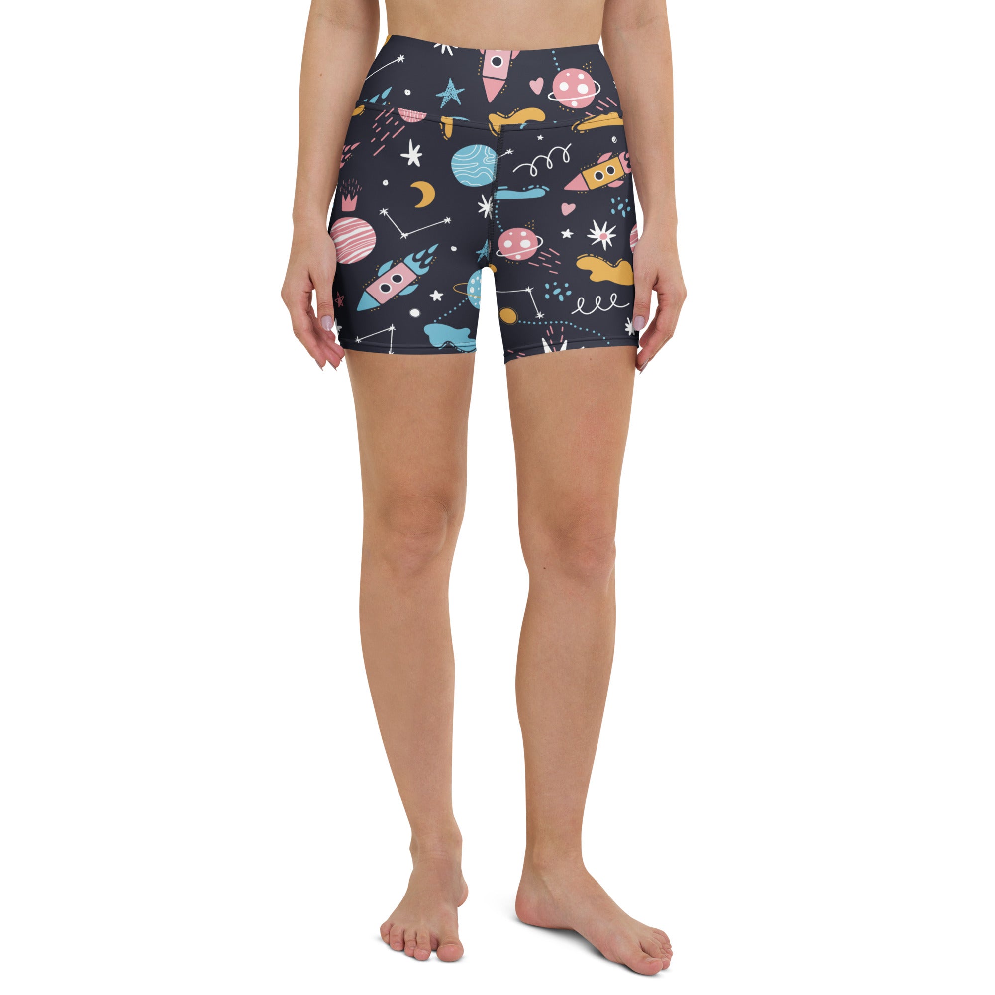 Dark blue high waisted buttery soft women’s outer space yoga shorts with colorful rockets planets and stars