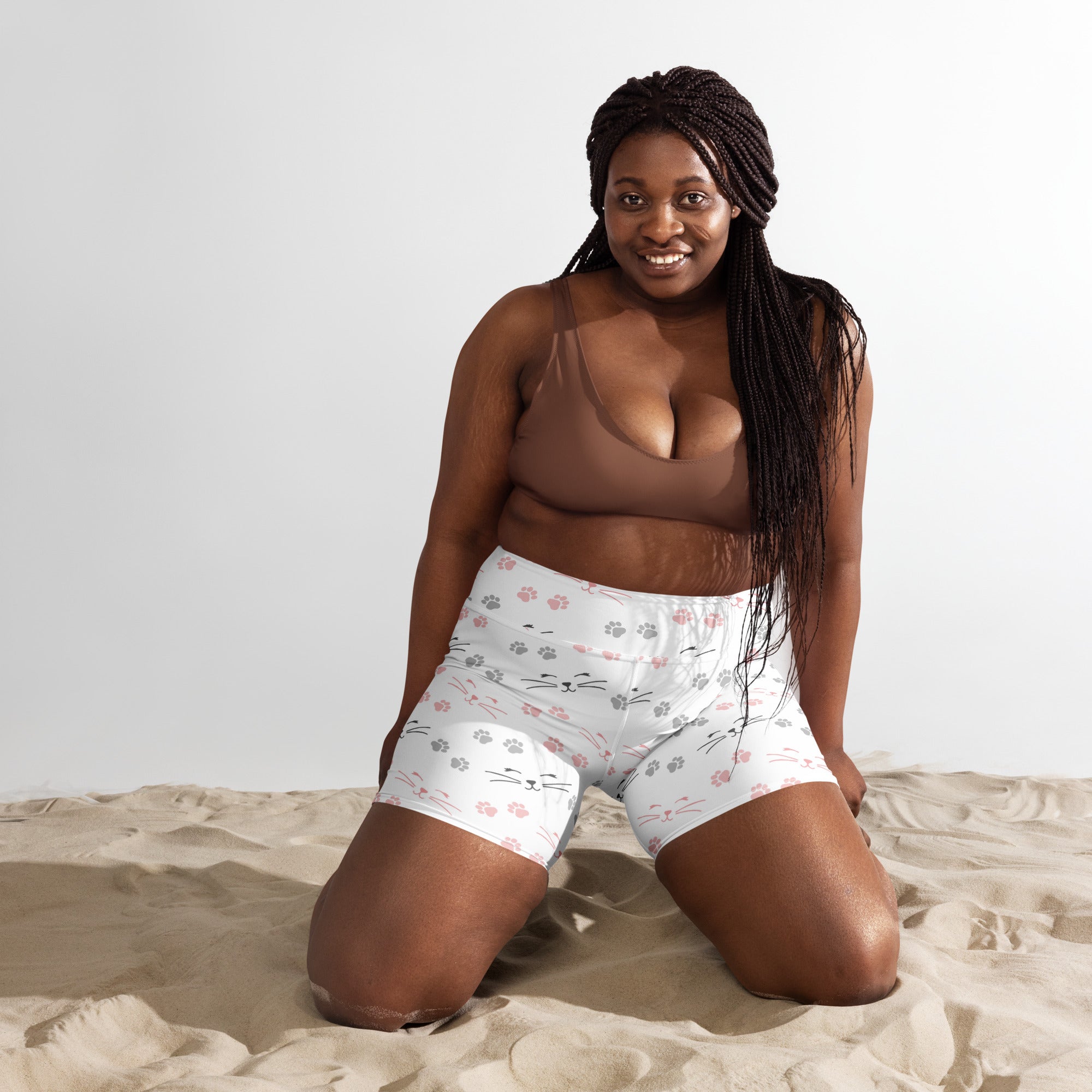 White high waisted cat paw print yoga shorts with playful pink and gray cat faces and buttery soft fabric