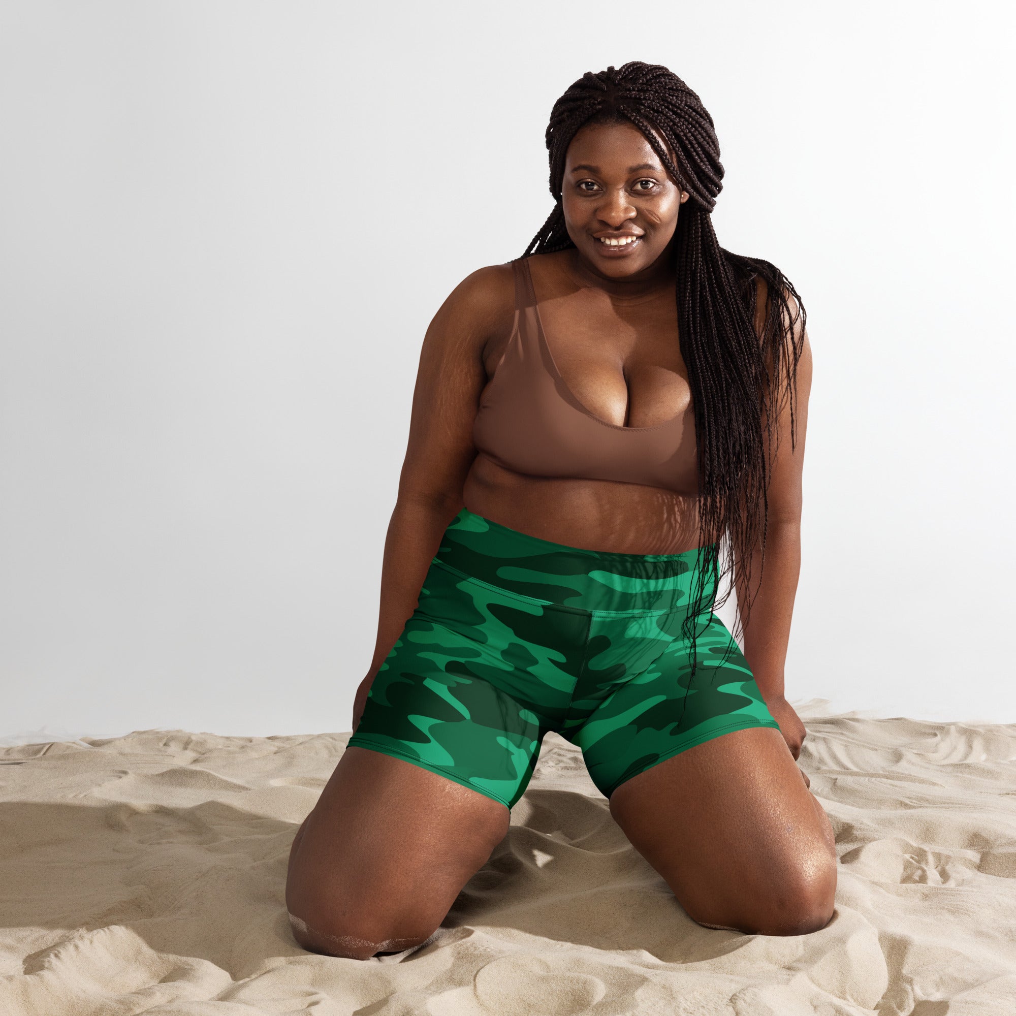 Women’s green camouflage high waisted yoga shorts made from buttery soft fabric for active wear