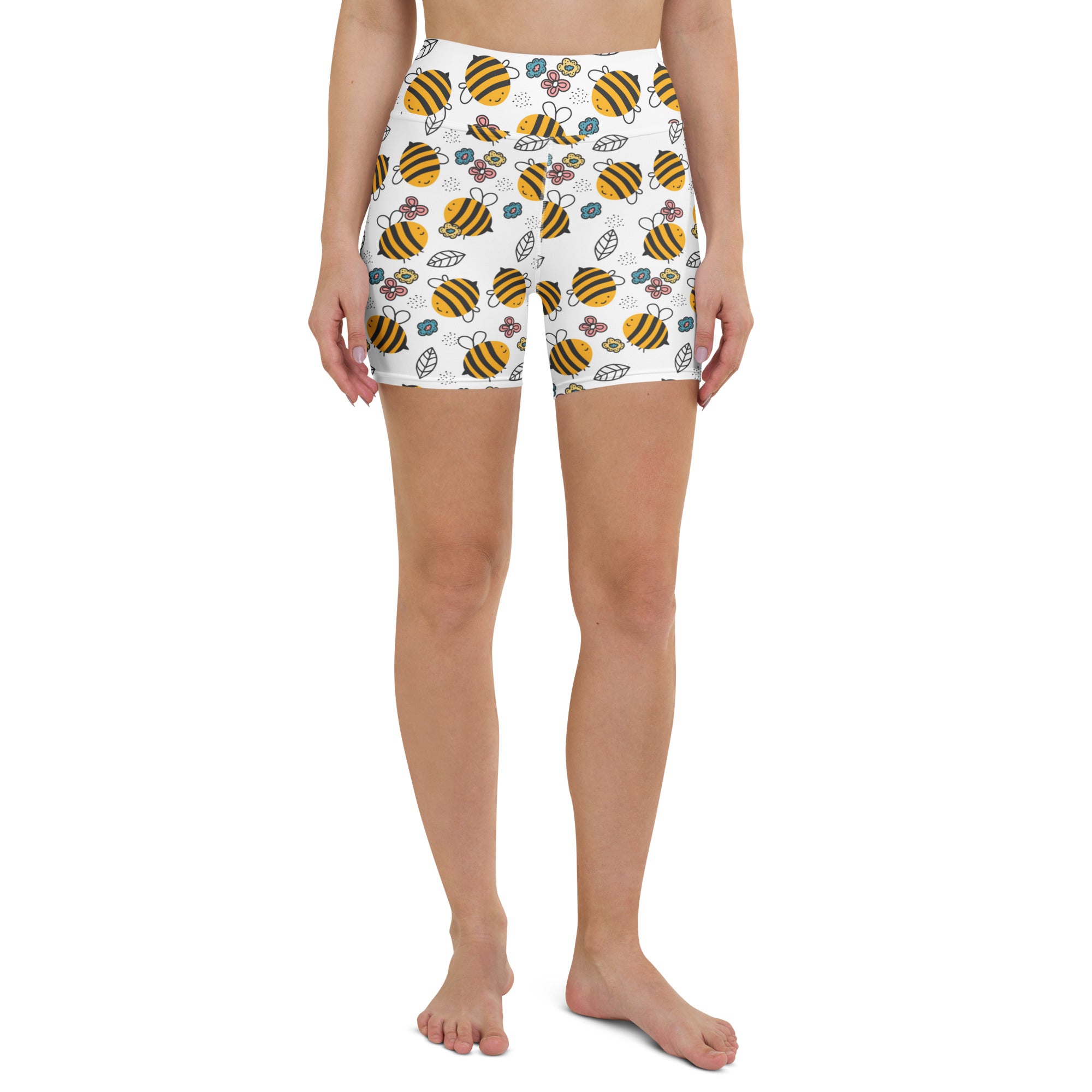 White high waisted buttery soft women’s yoga shorts with playful yellow and black bumblebee floral pattern