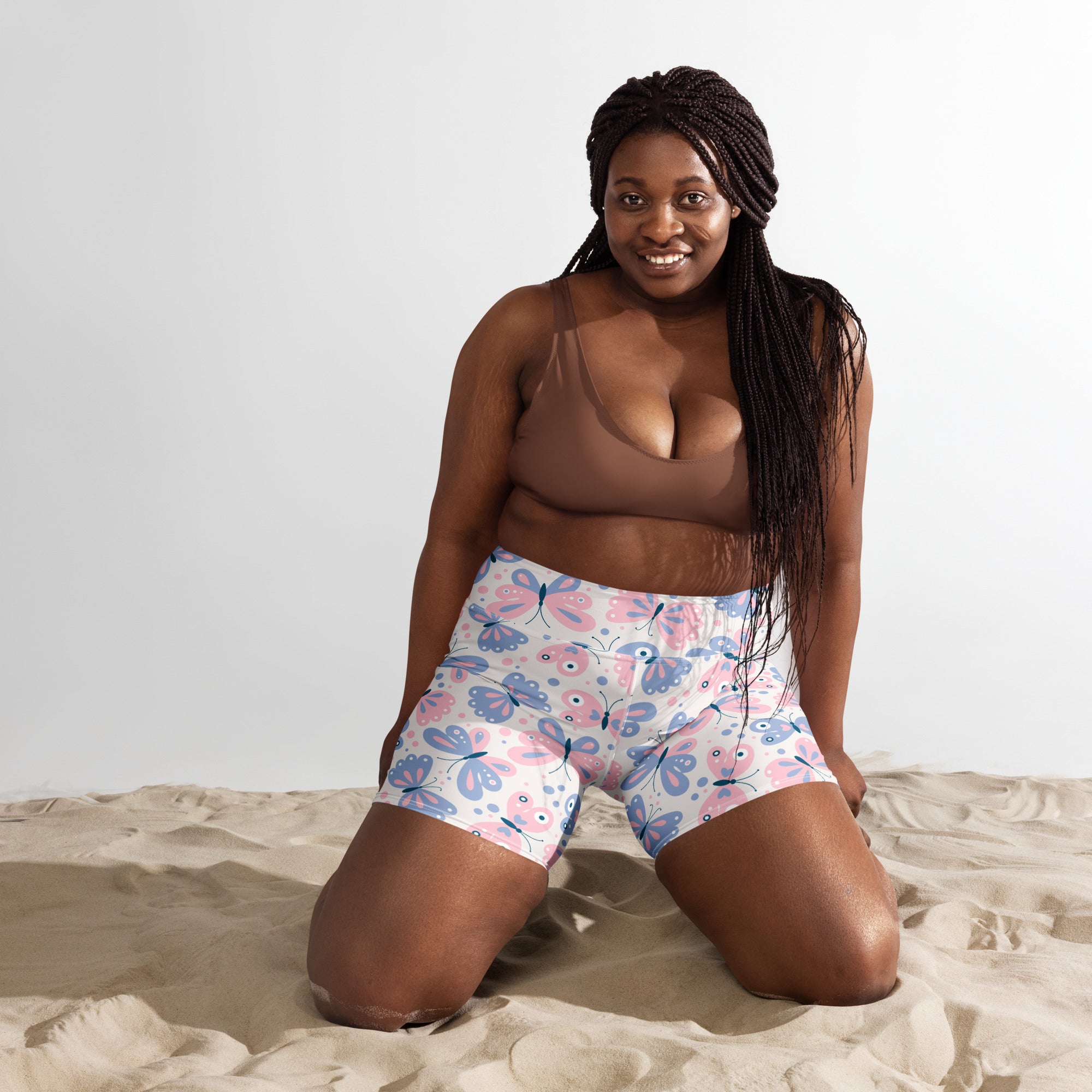 Women’s pink and blue butterfly print high waisted yoga shorts made of buttery soft fabric for active wear
