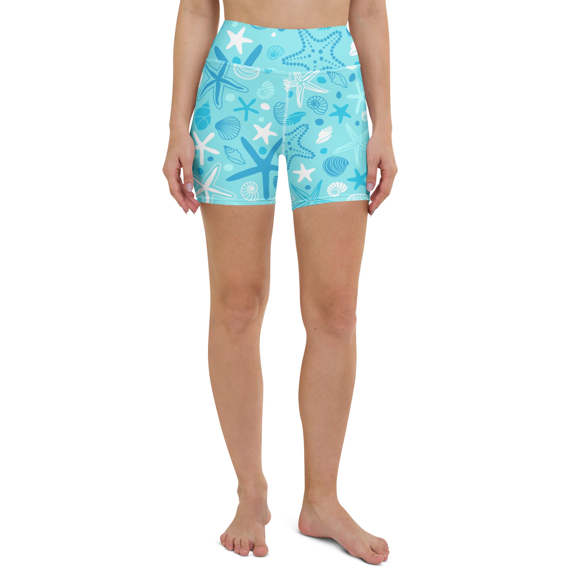 Turquoise high waisted buttery soft women’s yoga shorts with white and light blue starfish and seashell pattern