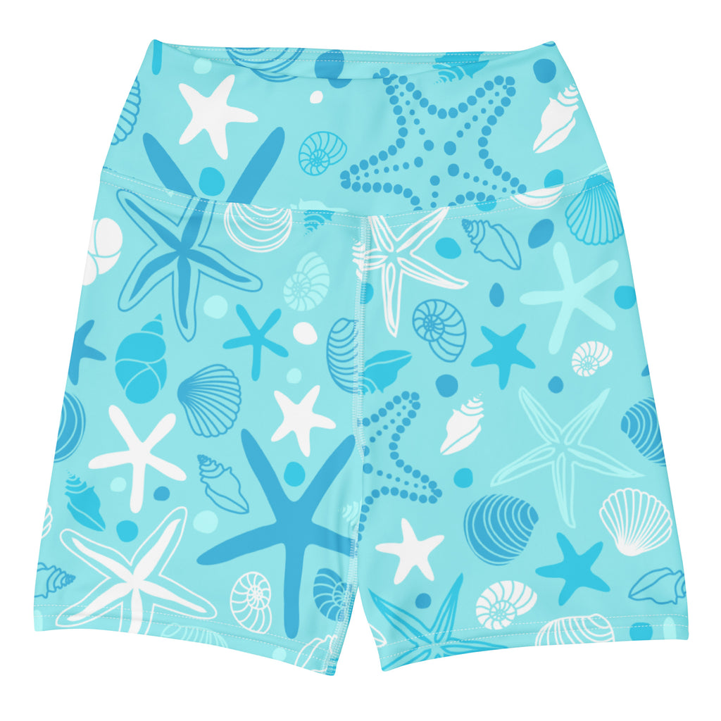 Light blue high waisted buttery soft women’s yoga shorts with playful white and dark blue starfish and shells pattern