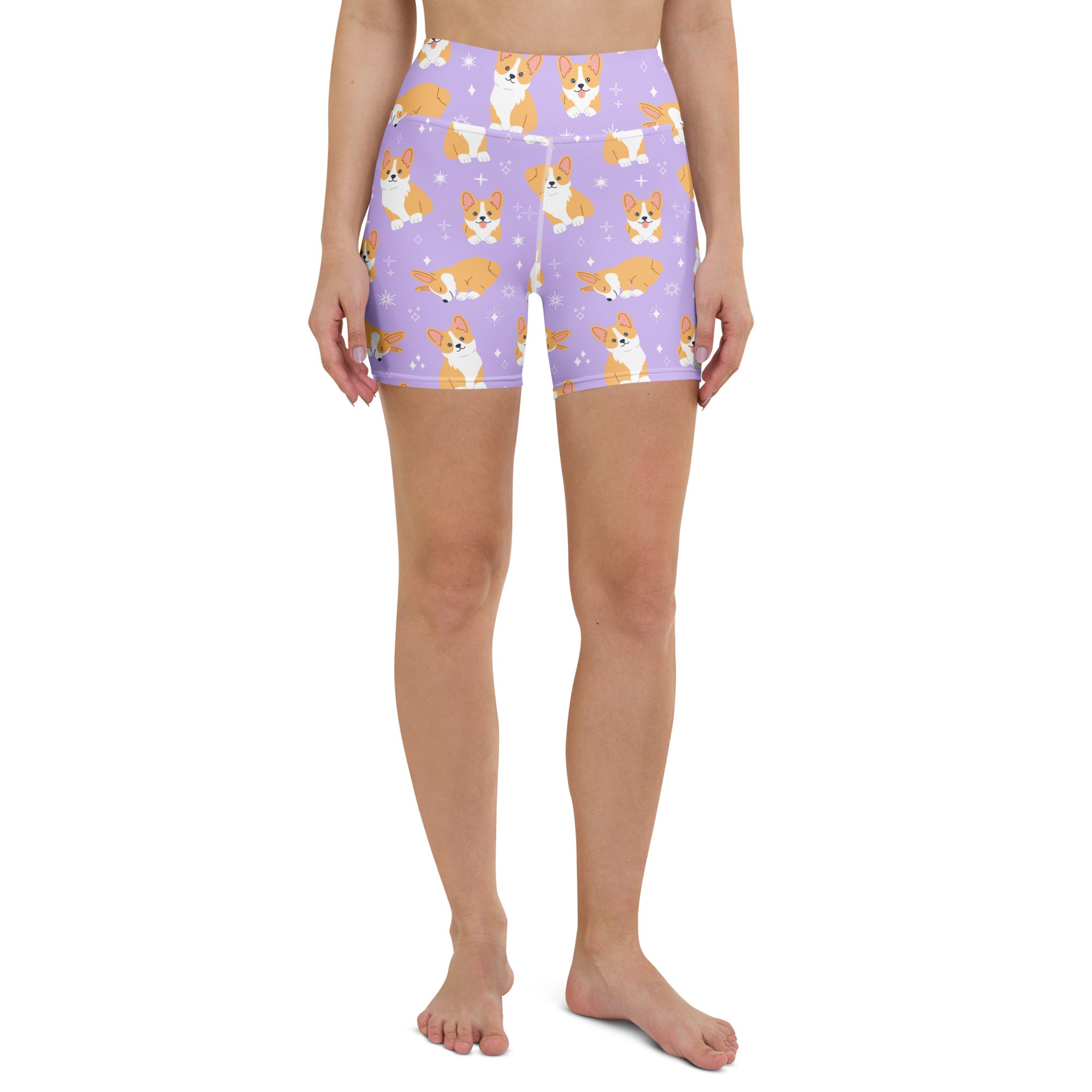 Women’s purple high waisted buttery soft yoga shorts with a tan and white cartoon corgi pattern