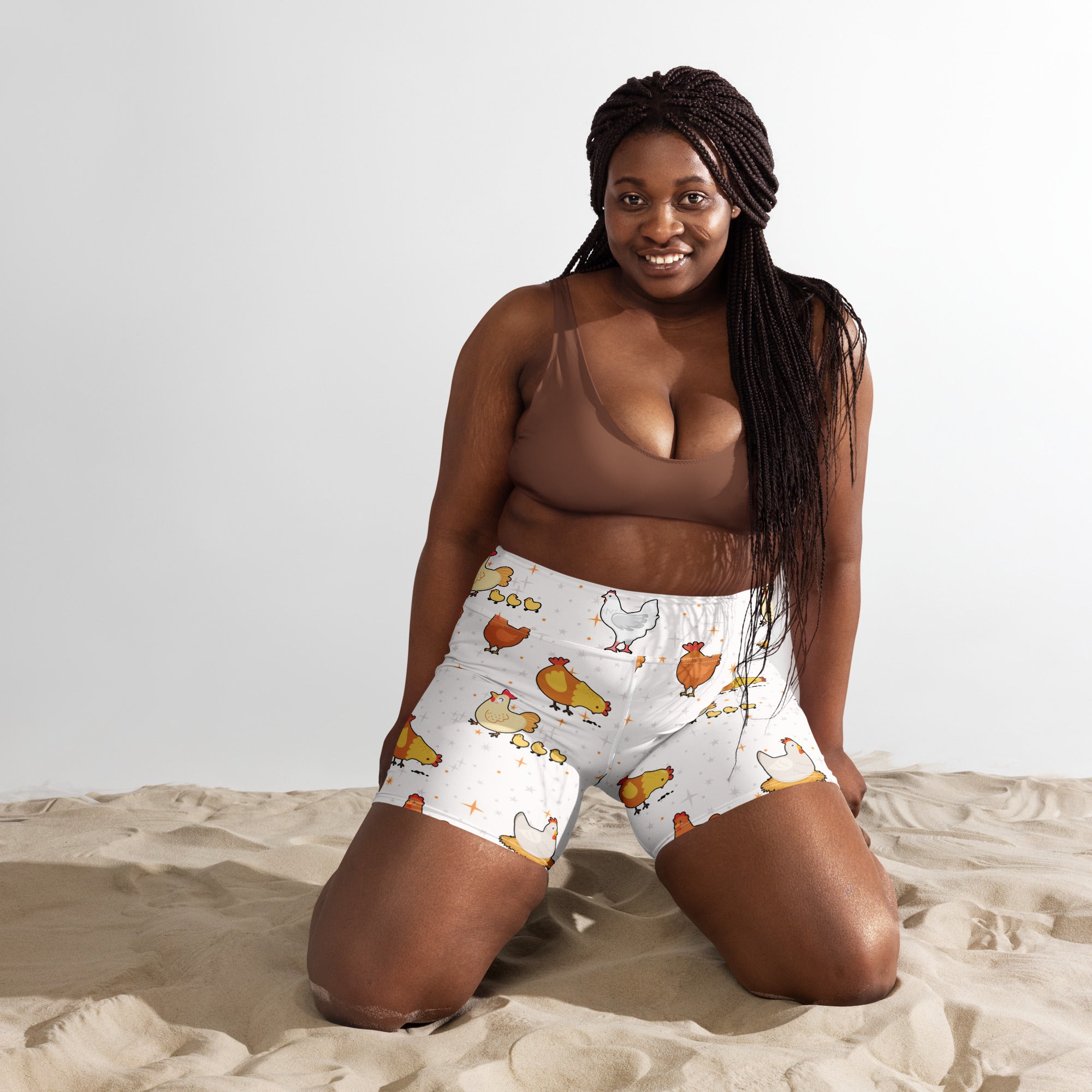 White high waisted buttery soft women’s yoga shorts with playful orange brown and white cartoon chicken pattern
