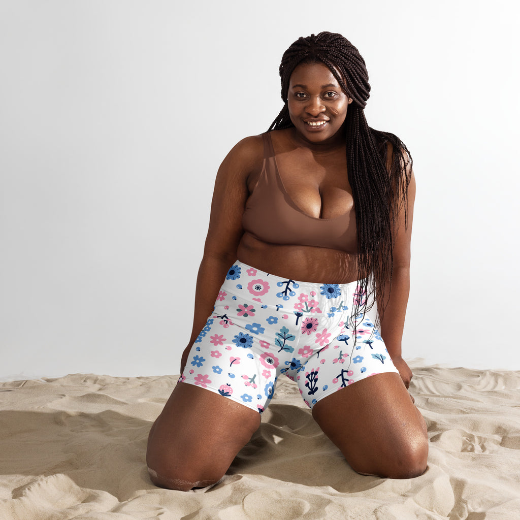 Women’s high waisted buttery soft white yoga shorts with colorful pink blue and green floral pattern
