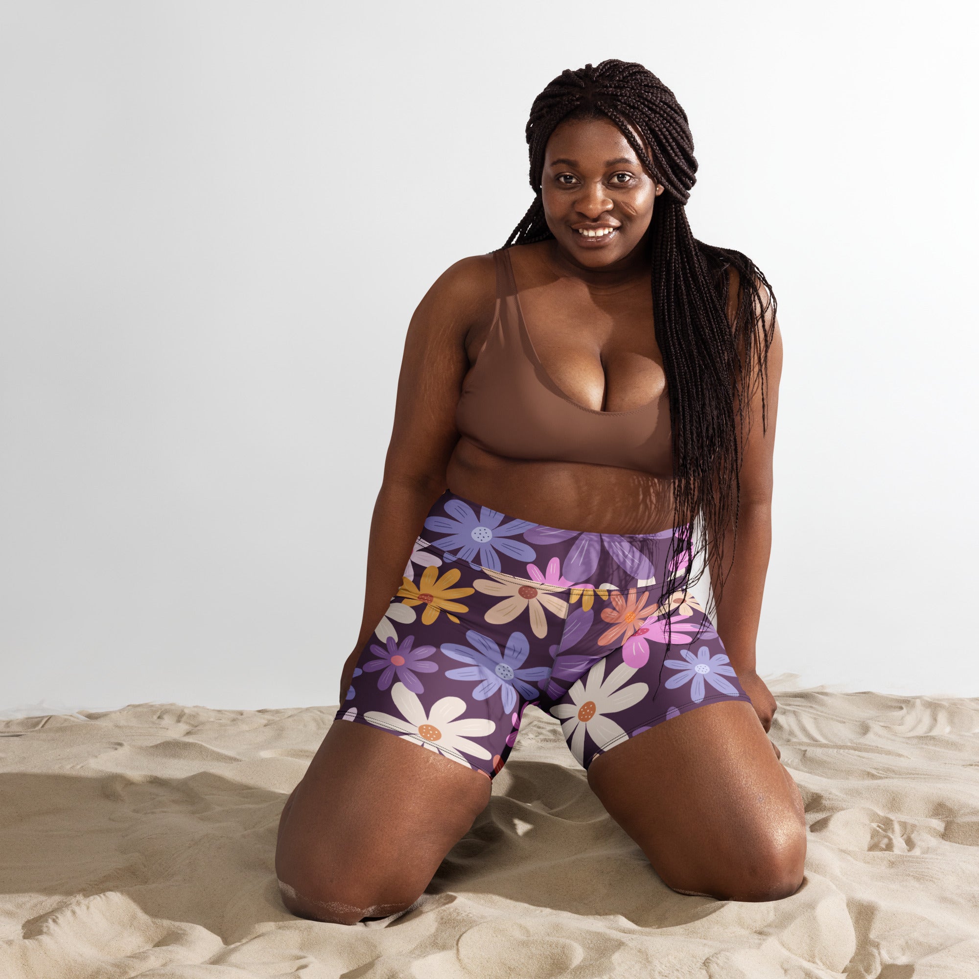 Women’s purple floral yoga shorts high waisted buttery soft with vibrant daisy motifs in white yellow pink and blue