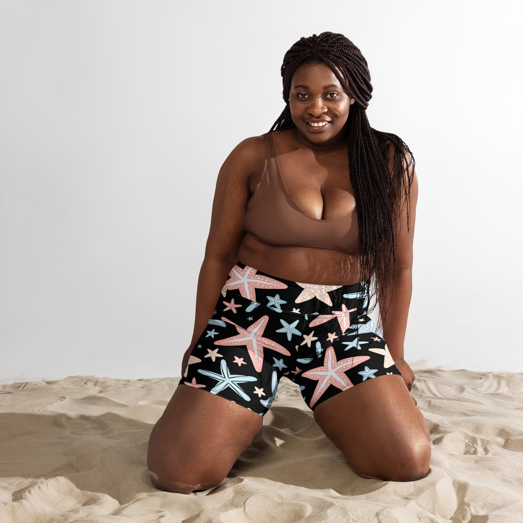 Black women’s starfish yoga shorts high waisted with buttery soft fabric and pink light blue white starfish pattern