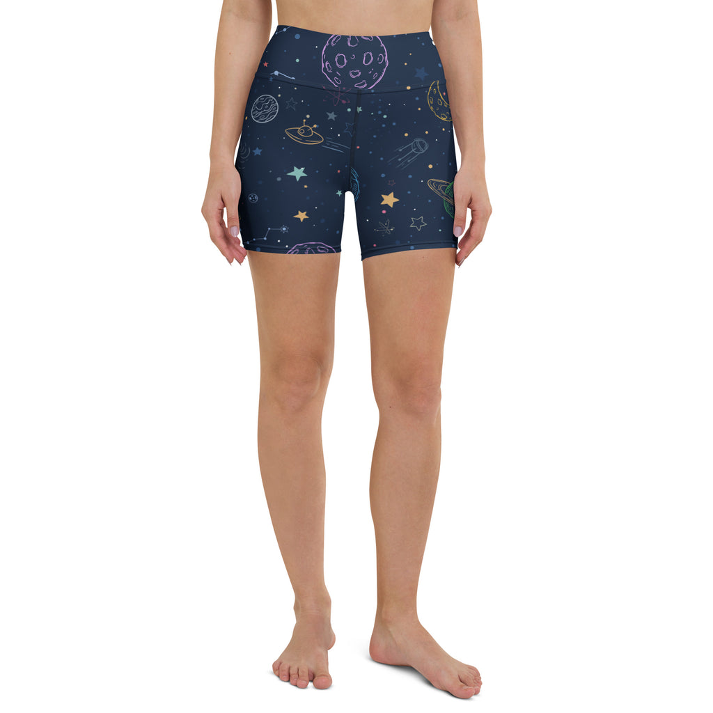 Dark blue high waisted buttery soft women’s yoga shorts with whimsical pastel space themed planets stars and ufos print
