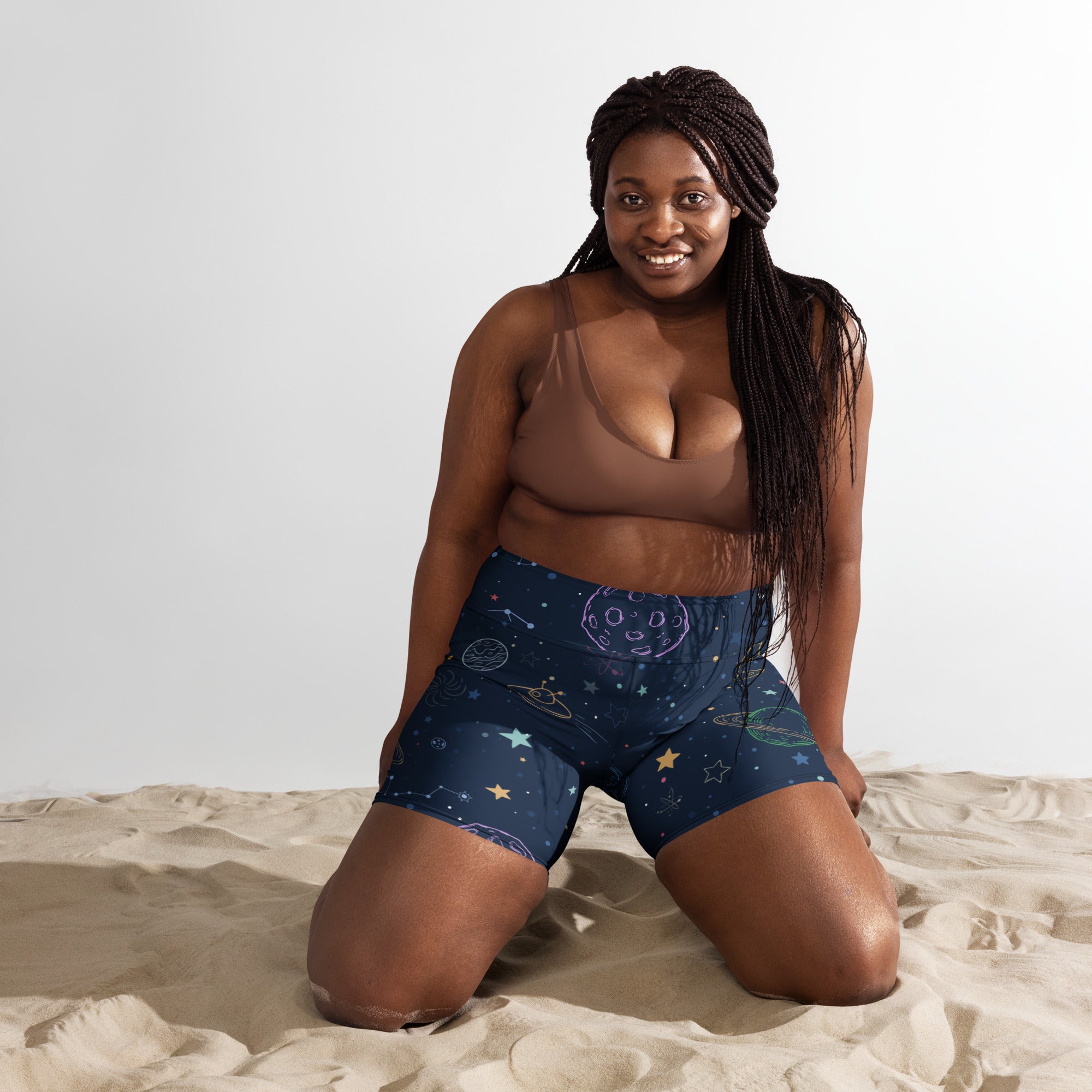 Women’s dark blue high waisted buttery soft galaxy space yoga shorts with planets stars and moon celestial designs