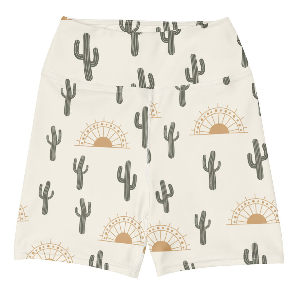 Cream-colored high waisted buttery soft women’s yoga shorts with gray cactus and tan sunset pattern