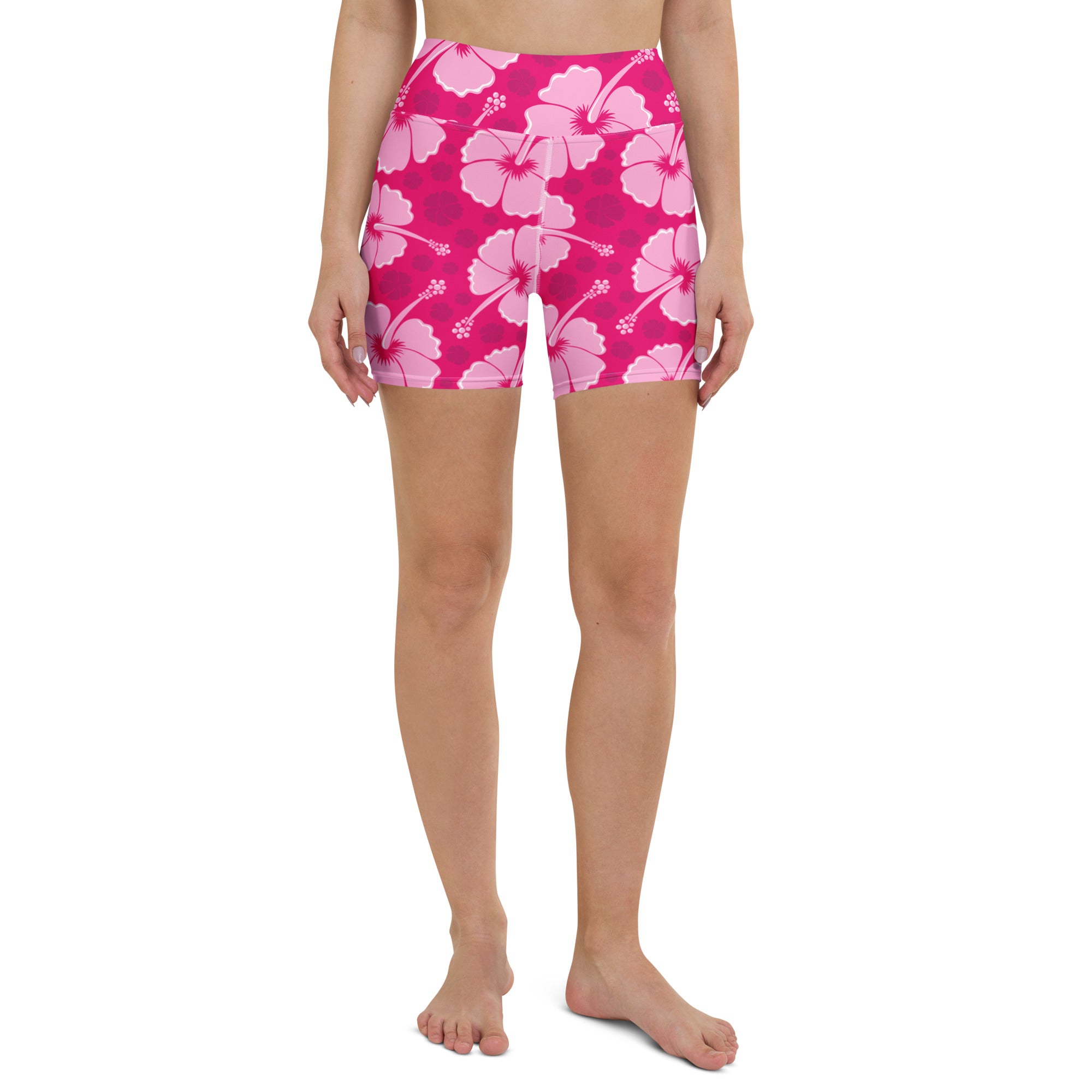 Women’s high waisted buttery soft yoga shorts in pink with a tropical hibiscus pattern for active wear