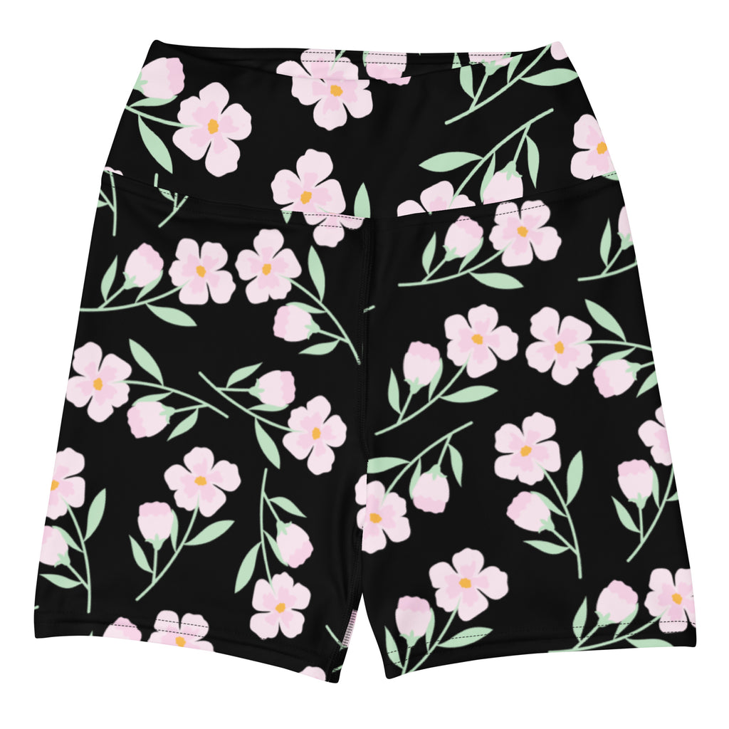Women’s black high waisted buttery soft yoga shorts with vibrant pink floral pattern and yellow centers