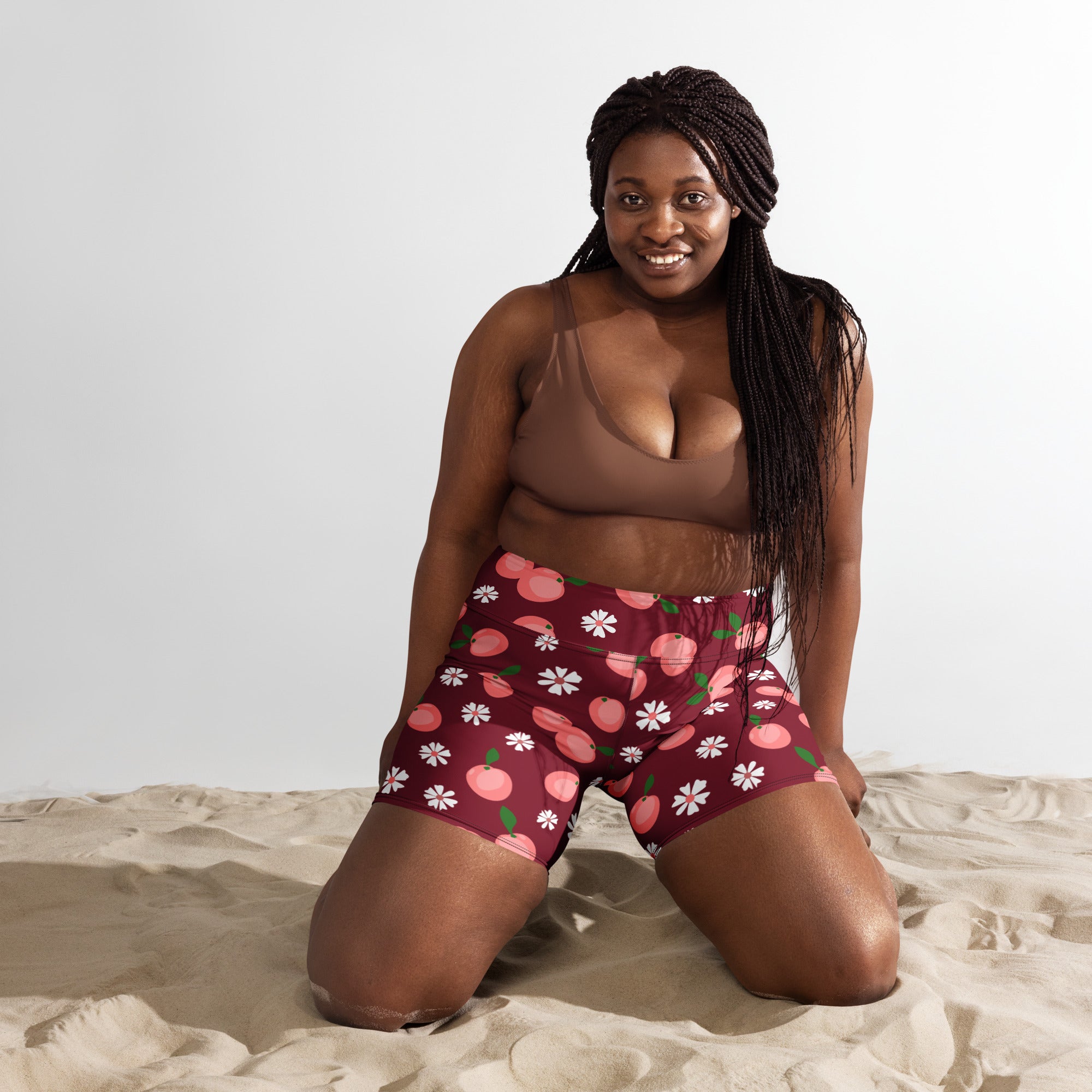 Women’s high waisted buttery soft maroon yoga shorts with playful pink peach and white daisy floral pattern