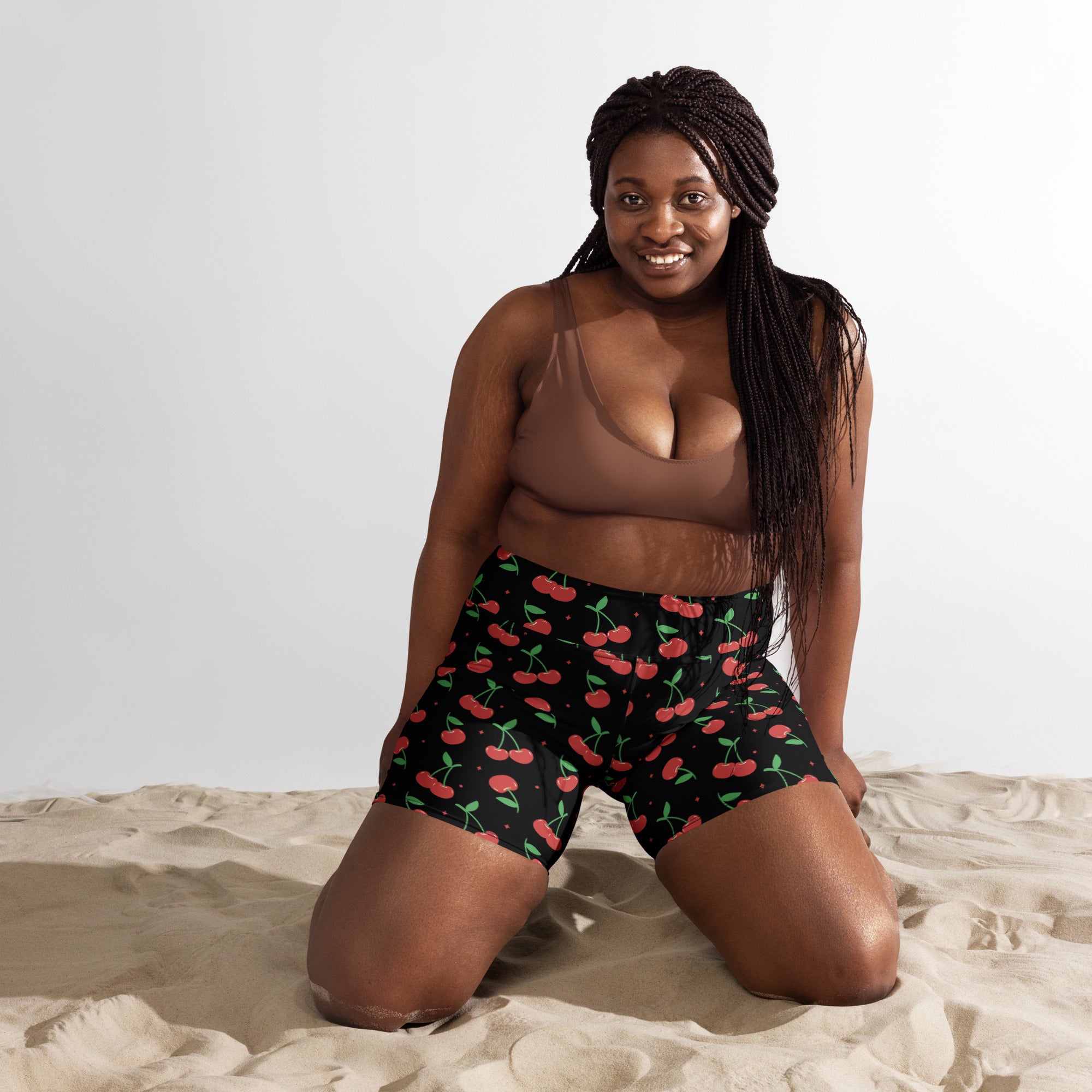 Women’s black cherry yoga shorts with high waisted fit buttery soft fabric and vibrant red cherry pattern