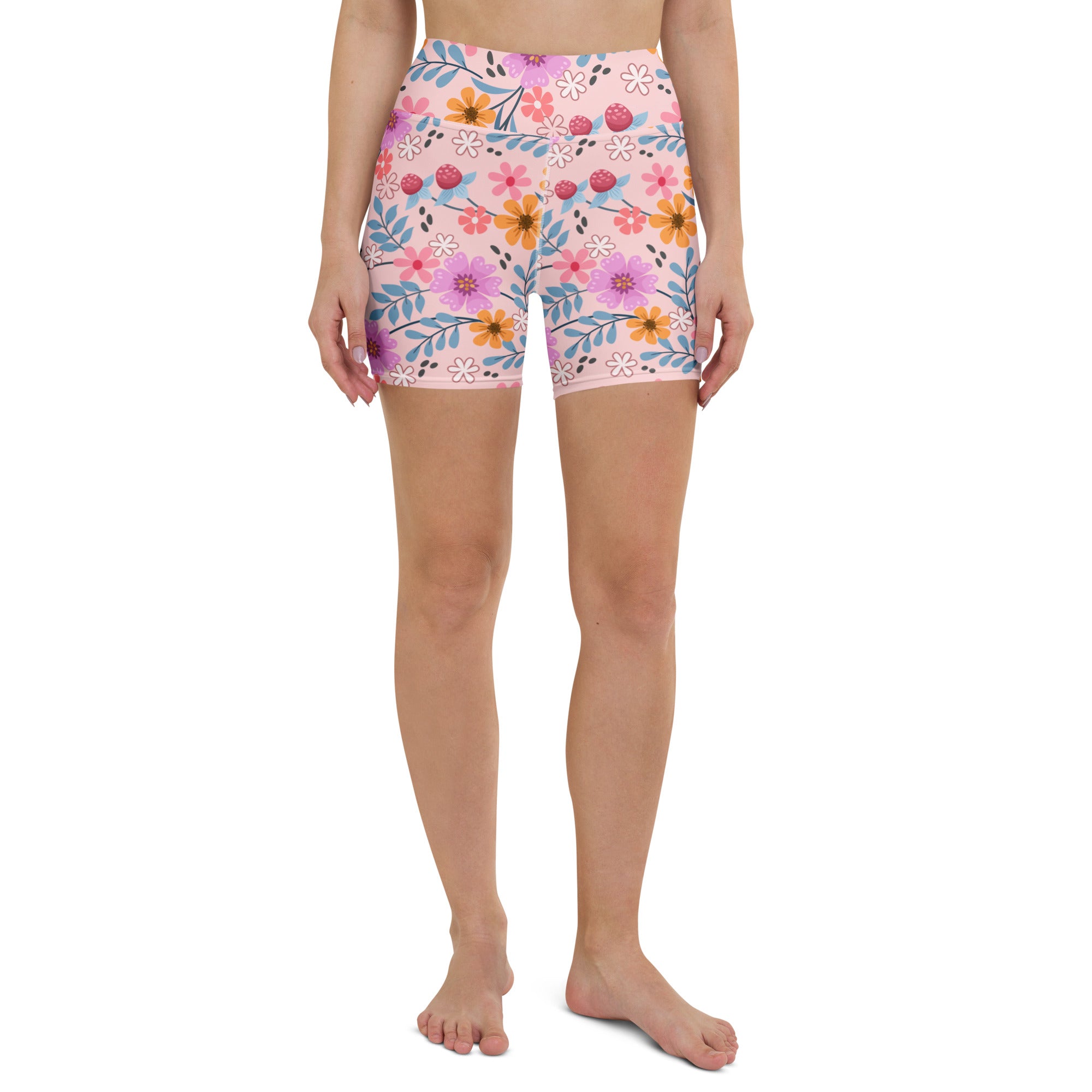 Women’s pink floral high waisted yoga shorts with buttery soft stretchy fabric and form fitting design