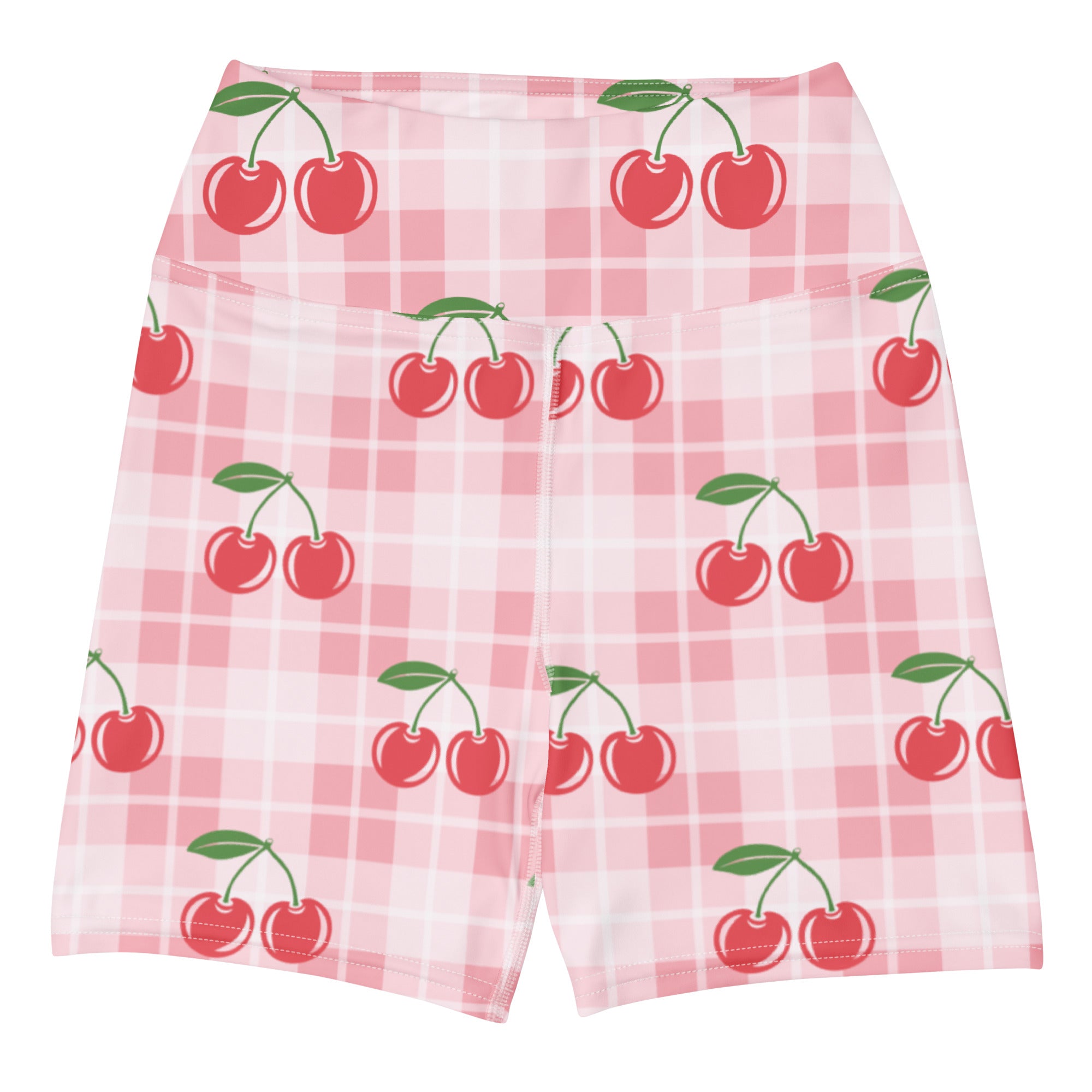 Women’s pink gingham cherry high-waisted yoga shorts in buttery soft fabric displayed on a plaid background