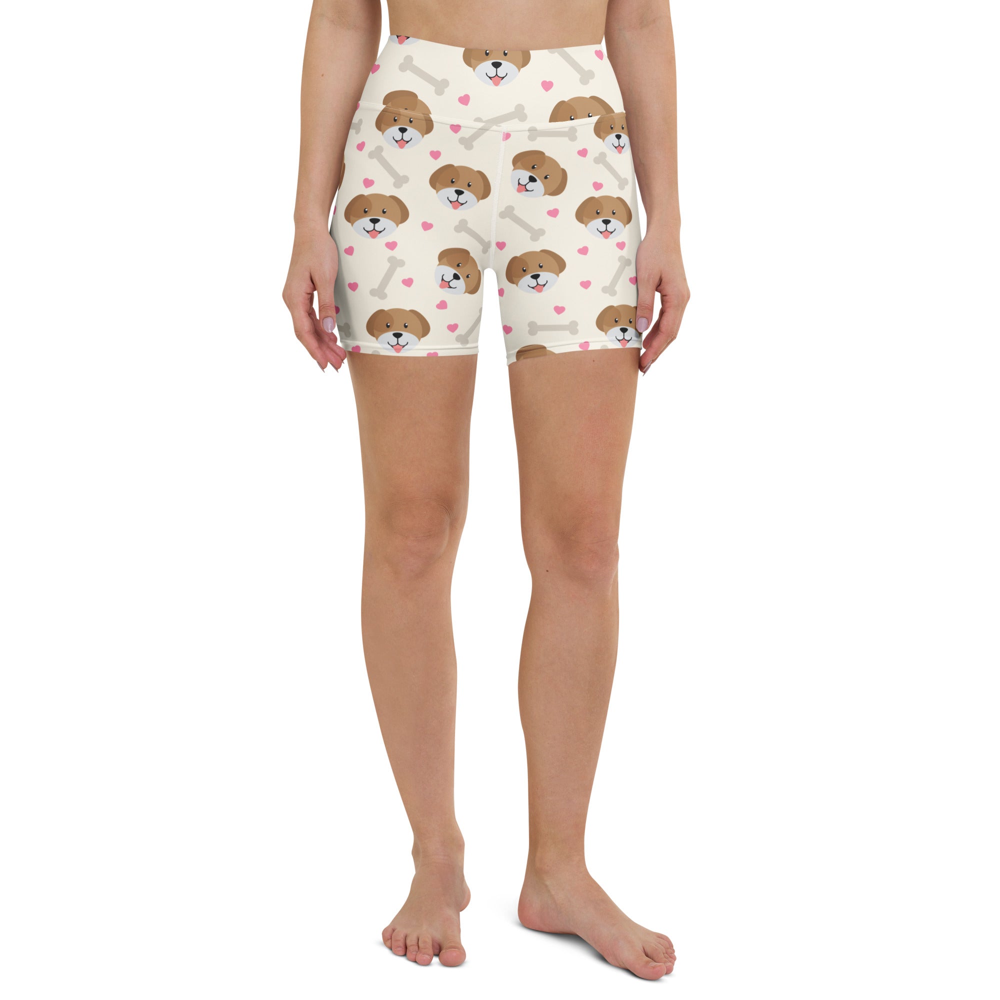 Cream-colored high-waisted buttery soft yoga shorts with cute brown puppy faces pink hearts and white bones print