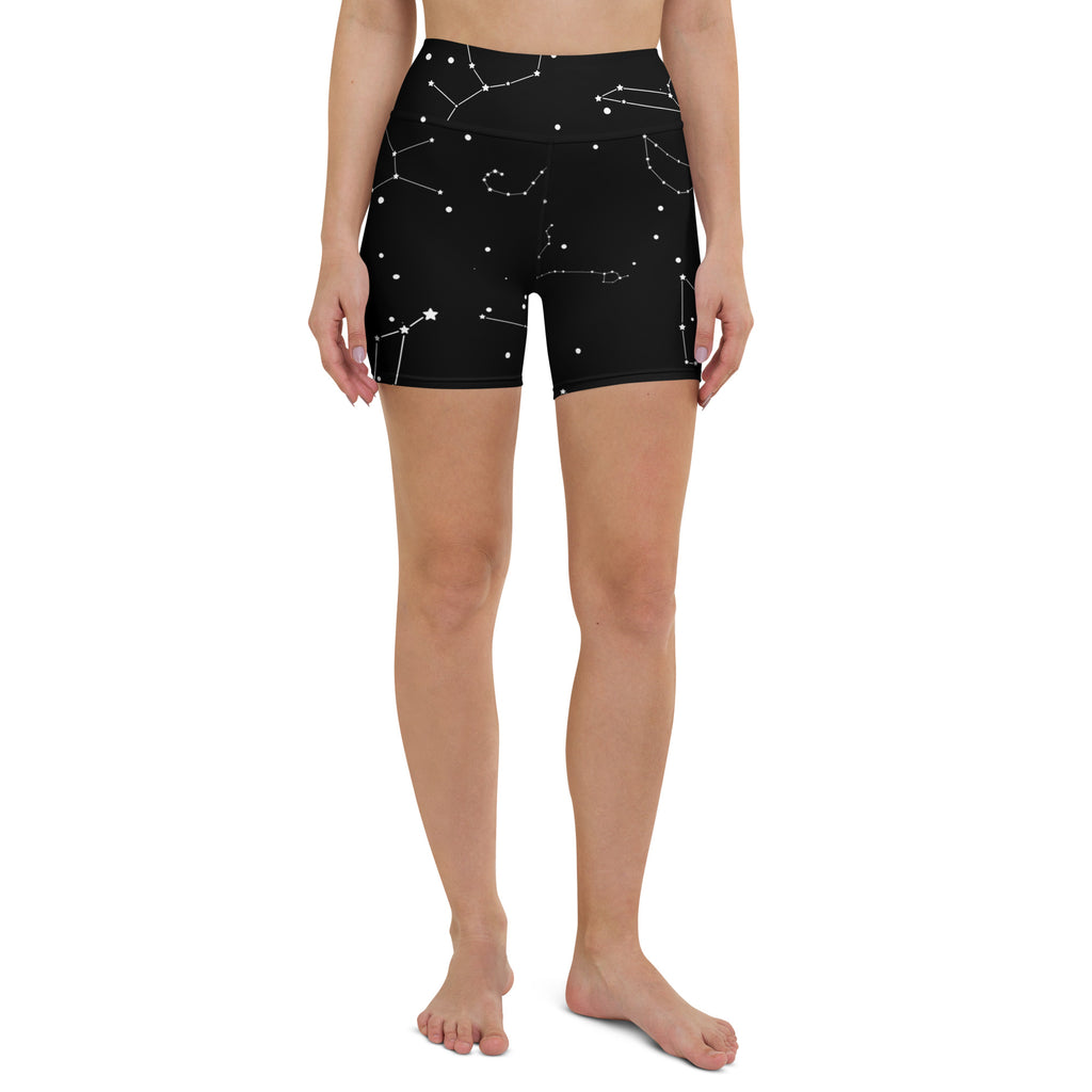 Black high-waisted yoga shorts with white constellation pattern made from buttery soft fabric for women