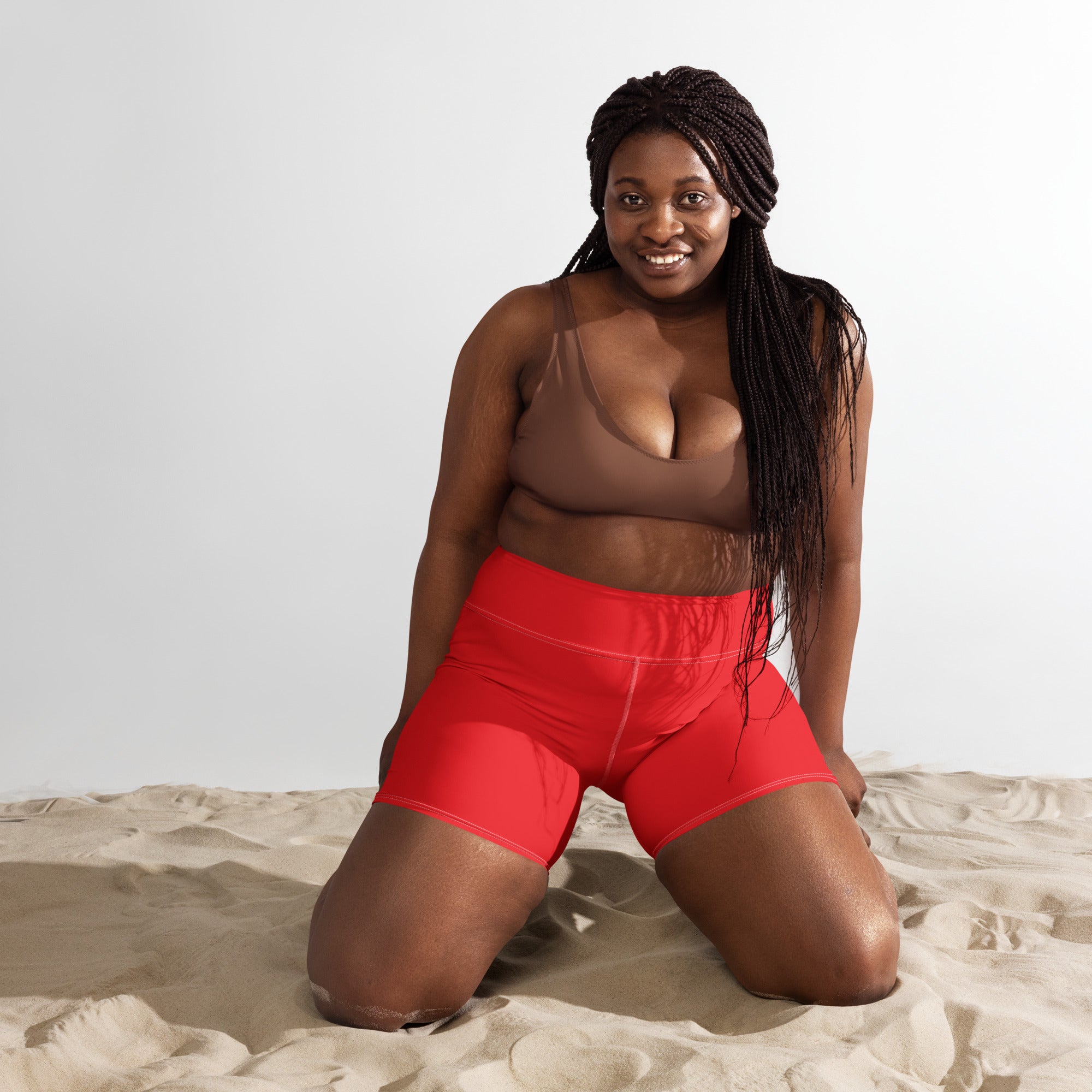 Women’s buttery soft red high waisted yoga shorts with smooth stretchy fabric and subtle seam detailing