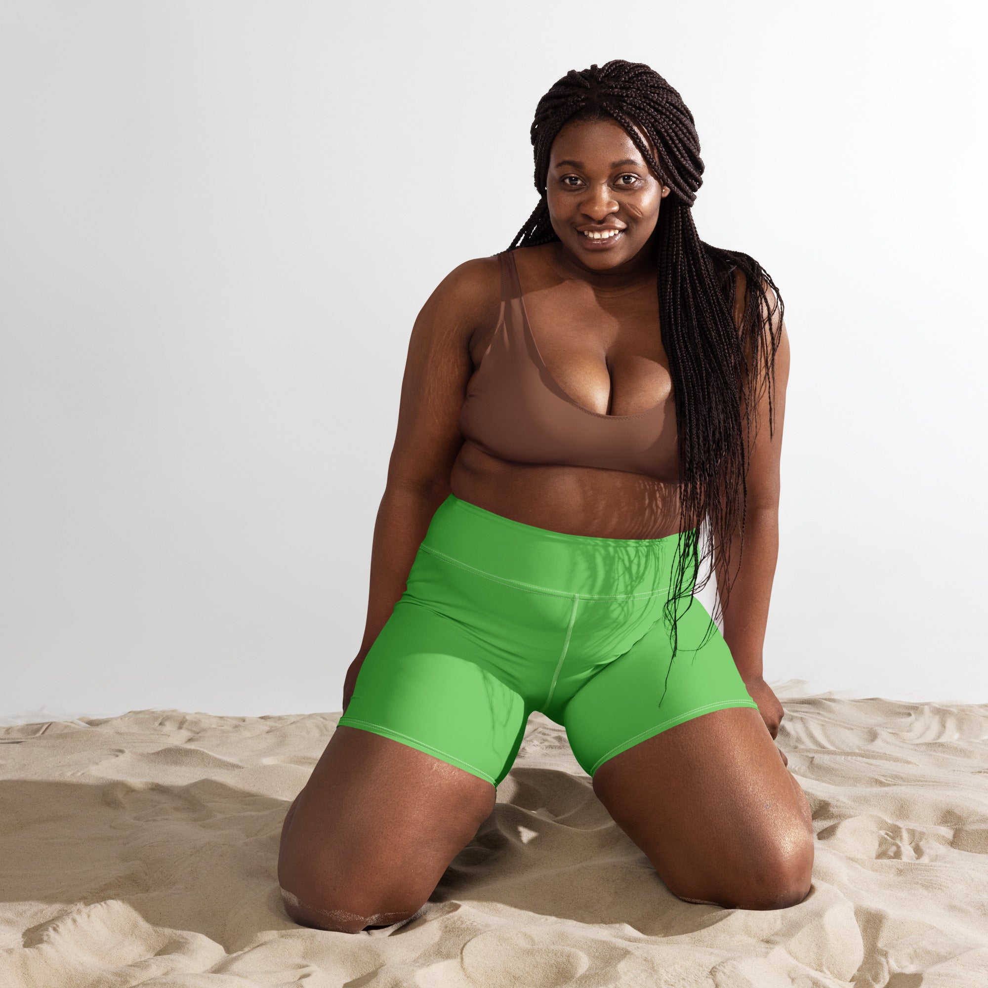 Bright green women’s high waisted buttery soft yoga shorts made from soft active material for exercise