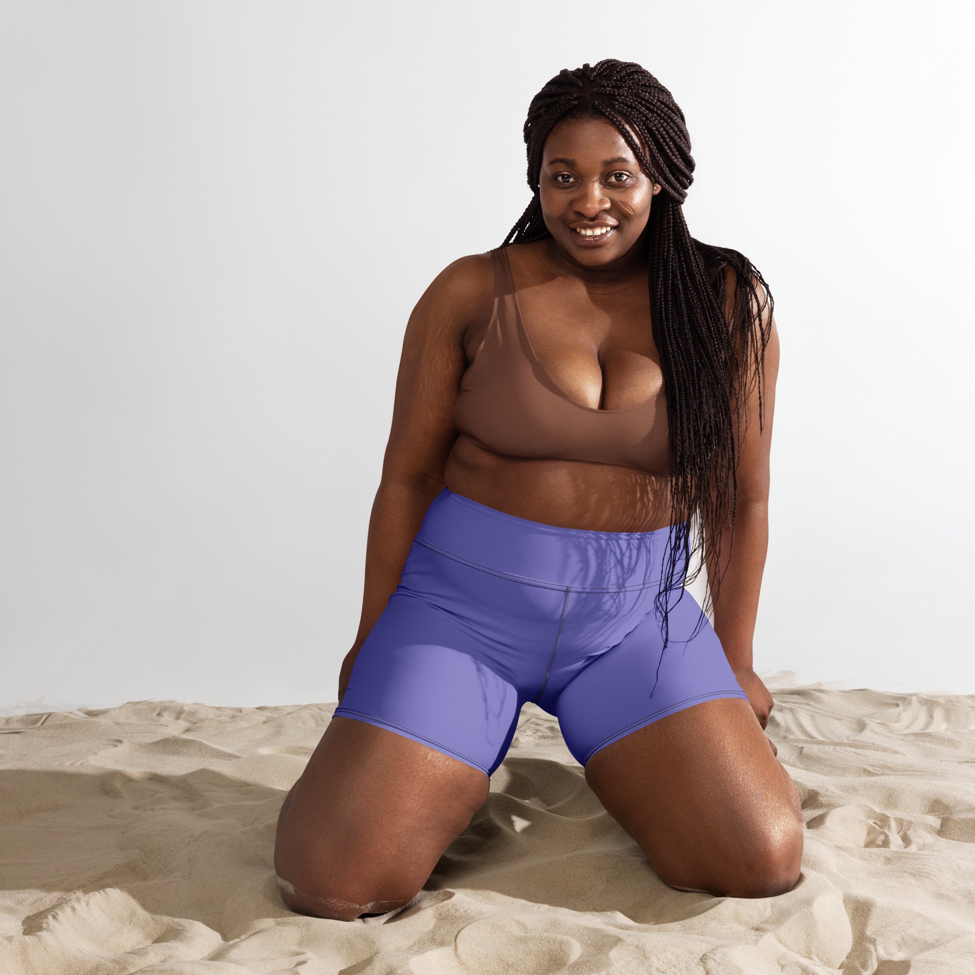 Women’s buttery soft purple high waisted yoga shorts made of soft fabric for comfortable active wear