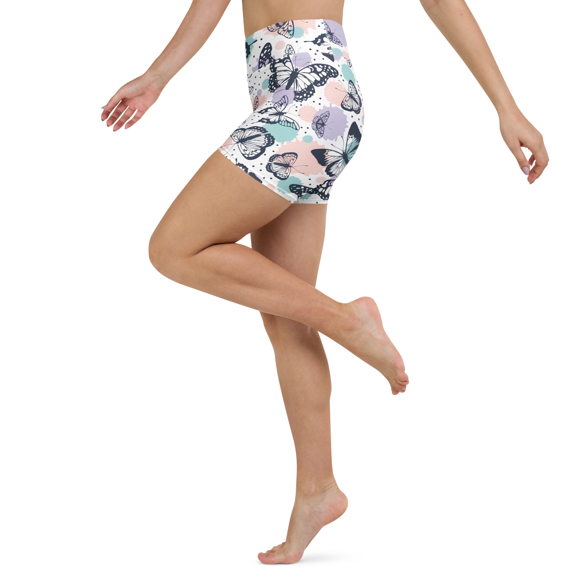 Women’s high waisted butterfly yoga shorts with black and white butterfly pattern on soft pastel buttery fabric