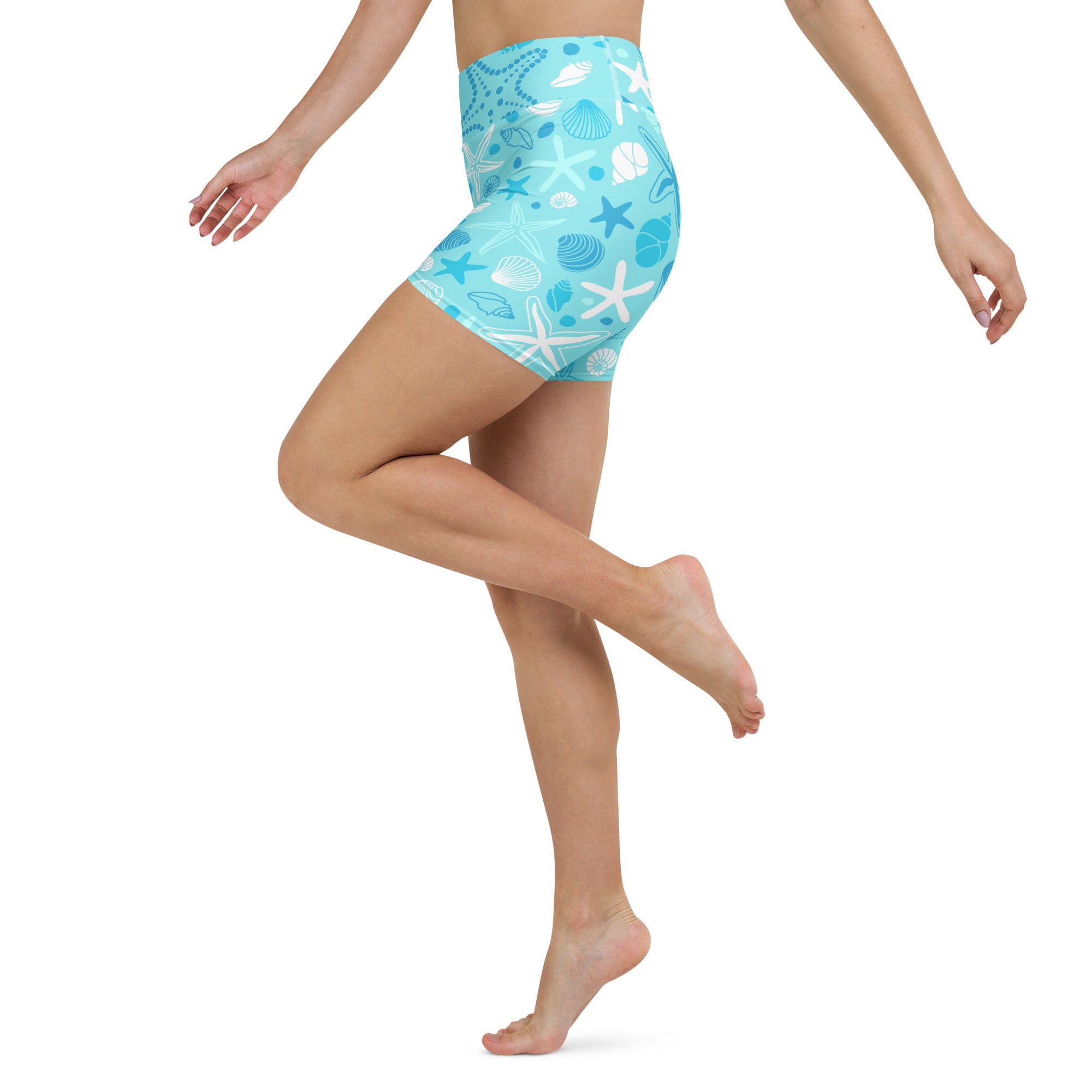 Women’s light blue high waisted buttery soft yoga shorts with white and dark blue seashells and starfish pattern