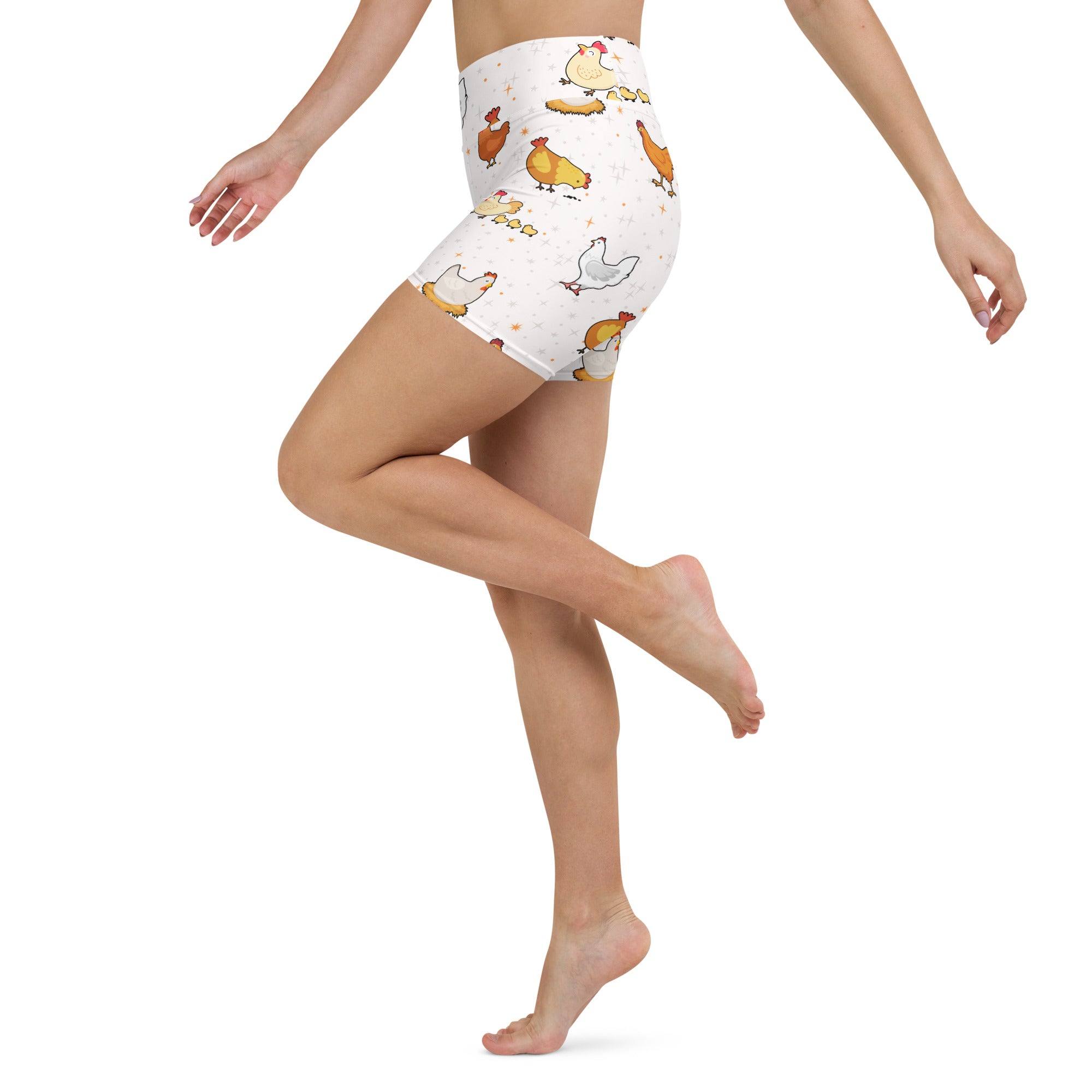 White high-waisted chicken yoga shorts with a playful multicolored cartoon chicken pattern and buttery soft fabric
